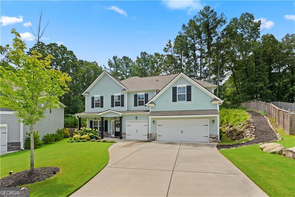 Nestled in the heart of Mableton, 540 Glen Abbey Circle is the dream home you didn't know you needed! With a generous 3,451 square feet of living space sitting on a lush .50+ acre lot, this 6-bedroom, 4-bathroom gem is more than just a house-it's your future home! Step inside to be greeted by spacious rooms that balance comfort and style. This open floor plan is perfect for entertaining. Got a penchant for culinary creations? The gorgeous kitchen offers all modern conveniences with upscale finishes. There's a huge walk-in pantry for extra storage and the formal dining room is just steps away to make Sunday dinners the place to be! There's also a guest room with ensuite on the main level. The oversized owners suite is a haven - with a cozy sitting area, spa-like ensuite and huge walk in closet. There are 4 additional bedrooms and 2 baths on the 2nd floor and a convenient laundry room. The private backyard and lovely covered patio with outdoor fireplace is a great place to entertain guests or sneak away for some solitude and your morning coffee. So why wait? Experience life at 540 Glen Abbey Circle today!