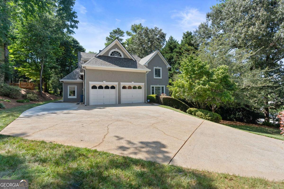 OPEN HOUSE SAT AUG 2ND 1-3PM & SUN AUG 3RD 2-4PM. ALL BUYERS WELCOME! Beautifully maintained home situated on a private, wooded lot in one of the area's most desirable communities of Acworth in Brookstone Country Club. This spacious residence offers an open and airy floor plan with soaring ceilings on the main level, abundant natural light and views of the amazing backyard pool. The two-story family room features a cozy fireplace and flows seamlessly into the formal dining room and kitchen, complete with granite countertops, stainless steel appliances, ample cabinetry, and a large island perfect for entertaining with countertop seating and a breakfast nook. The family room also flows into the screen porch overlooking the private backyard oasis and fenced yard. Upstairs, you'll find generously sized secondary bedrooms and a stunning oversized primary suite with vaulted ceilings, a wall of windows, and serene views of the backyard. The en-suite bath offers a relaxing retreat with a soaking tub, separate shower, and walk-in closet. The fully finished terrace level provides incredible additional living space, including a media/game room, home gym, private office, bonus bedroom, full bathroom, a bar area, tanning bed room, and a workshop with exterior access-ideal for storage or hobbies. Step outside to your own backyard oasis featuring a vaulted screened-in porch with skylights, overlooking a saltwater pool and spa surrounded by lush landscaping and complete privacy. The pool heater new in 2020, pool filter 2024, pool pump 2023, pool lights converted to energy efficient LEDS, and serviced regularly by Crystal Clear. Located just minutes from top-rated Cobb County schools, shopping, nearby dining, Cobb County parks, and trails. This move-in ready home is a rare find in a prime Acworth location. Brookstone Golf & Country Club offers optional Swim/Tennis membership along with a swim team, onsite restaurant and pickleball courts. Top rated amenities at your convenience-making this not just a home, but a lifestyle. Just minutes to Downtown Acworth, Lake Allatoona and Lake Point Sports Complex. The YMCA is just a few minutes away. Pitner Park just around the corner with mountain bike trails and walking trails. Extra parking pad to the left of the garage makes a great space for guests or an extra vehicle. Exterior painted 2021, HVAC systems 7 years old, water heater 2.5 years old, and A BRAND NEW ROOF & GUTTERS IN 2024.