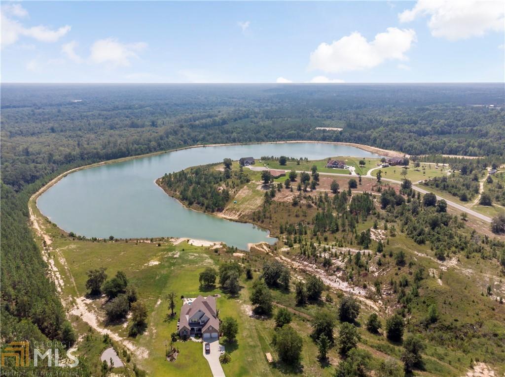 Beautiful lot located in The Bluffs subdivision! This is the perfect custom home site. Close to Brunswick and Jesup. Don't miss out on this great opportunity for your future custom home site! Located in a USDA eligible area!!
