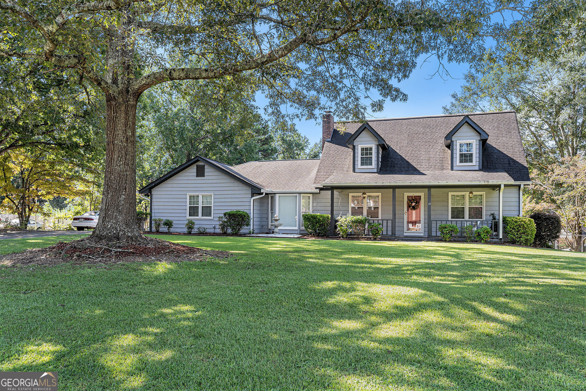 Welcome to this well-cared-for ranch-style home located in the quiet and established Country Roads community of Stockbridge. Featuring three spacious bedrooms and two full bathrooms, this home offers a warm and functional layout perfect for everyday living. The eat-in kitchen includes built-in cabinetry and a cozy dining area, while the family room centers around a brick fireplace with custom built-ins, creating a welcoming space for gatherings. Natural light flows through the home, highlighting a mix of tile and carpet flooring. The exterior has been updated with classic wood siding, adding to the home's charm and curb appeal. An attached garage adds convenience, and the generous backyard provides plenty of space for outdoor living or future possibilities. This home combines comfort, character, and a peaceful neighborhood setting-ready for you to make it your own.