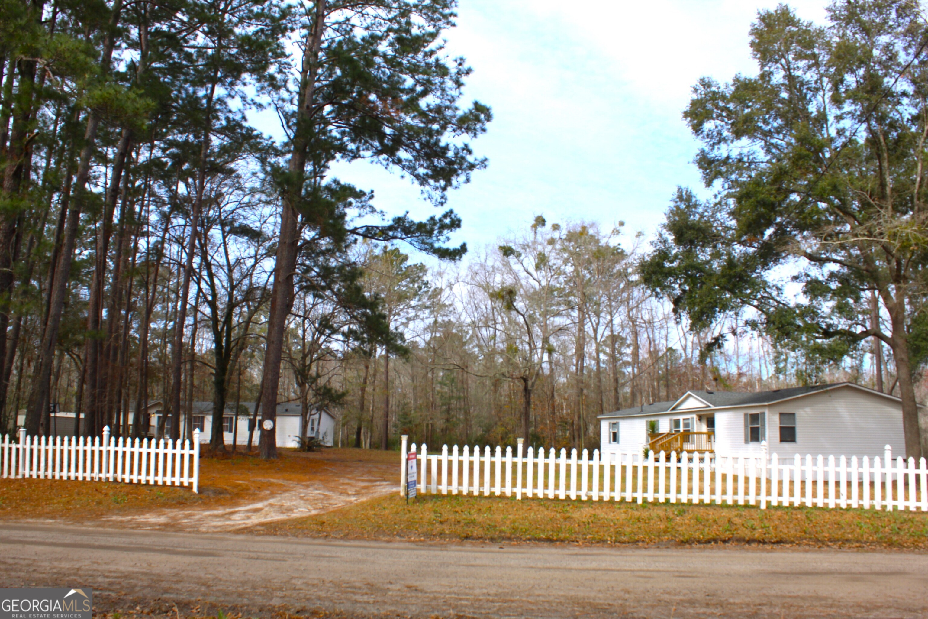 Two mobile homes situated on 3 private acres in Midway! Each home features large decks, perfect for outdoor living and entertaining. Both homes feature 3B and 2BA. Both homes have been extensively remolded in 2022 to include new roofs and HVAC systems. A deep well serves the property, adding convenience and value. With income-producing potential, this property is ideal for investors or those seeking a quiet retreat with room to spread out. Live in one and rent the other or use both as rental income opportunities. This property is proven with rental income that remains steady. Don't miss this chance to own a versatile property in a peaceful setting! This property is occupied and will be shown by appointment only! Please see agent remarks!