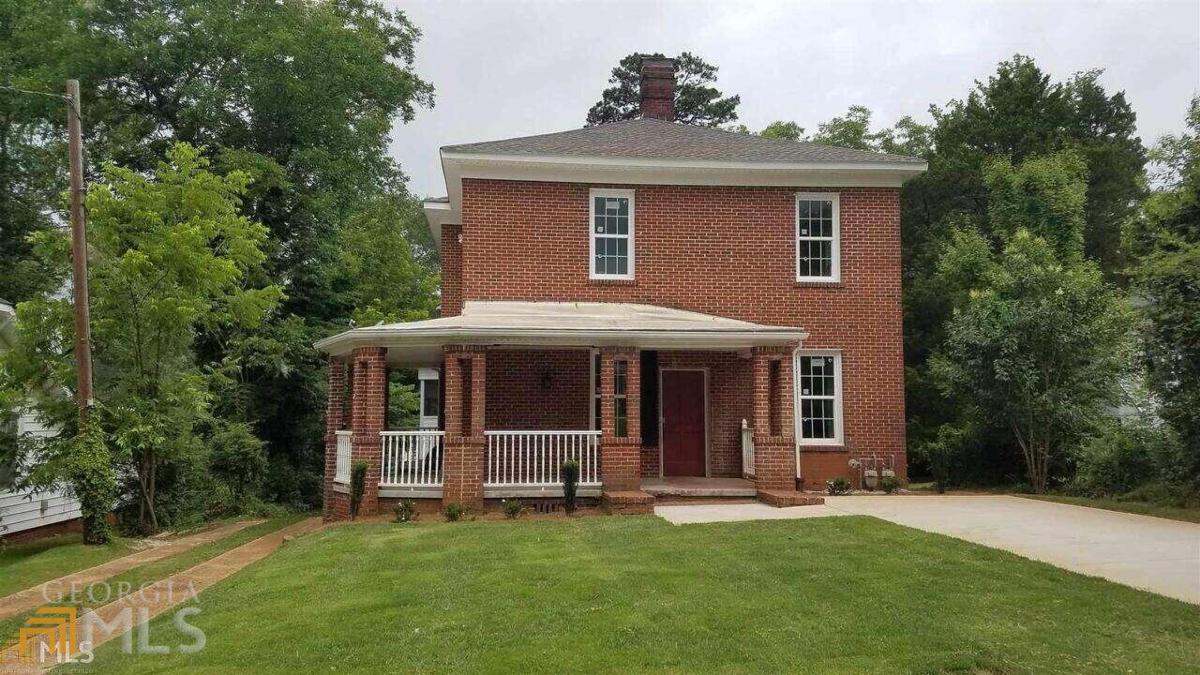 Downtown living, just a few blocks from LaGrange College, 410 Park Avenue...featuring 1500 square feet, two bedrooms, one bath. Newly renovated, highlighting hardwood floors, granite tops in bathroom, and equipped kitchen. Screened in porch and a beautiful private deck with access to the kitchen, and spacious closets. Reminiscent of an urbane loft in a refined area in a large city. The beautiful natural light in each room adds to the spacious setting. Landscape maintenance and pest control included. Washer/dryer included.