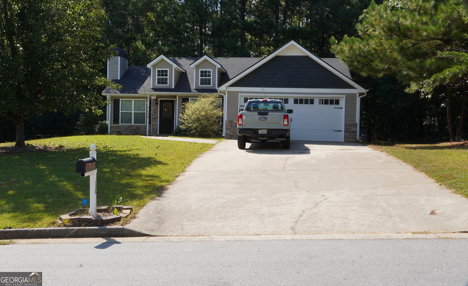 Welcome home to this well-kept 3-bedroom, 2-bath ranch nestled on a serene 0.52-acre homesite. Bathed in natural light, the inviting layout centers around a warm living room featuring a striking stone fireplace-perfect for cozy evenings. The eat-in kitchen offers ample space for casual dining and shines with stainless steel appliances. Retreat to the spacious primary suite with a tray ceiling, generous walk-in closet, and a spa-like bath complete with a stand-up shower and relaxing soaking tub. Two additional bedrooms and a hall laundry closet add everyday convenience. Enjoy peace of mind with a security system and cameras that convey with the home. A roomy 2-car garage provides extra storage and parking, while the expansive yard offers space for gardening, play, or outdoor entertaining. Fenced in back yard. Combining comfort, style, and practicality, this charming ranch is move-in ready and moments from everyday amenities. Don't miss your chance to make this light-filled home on over half an acre yours!
