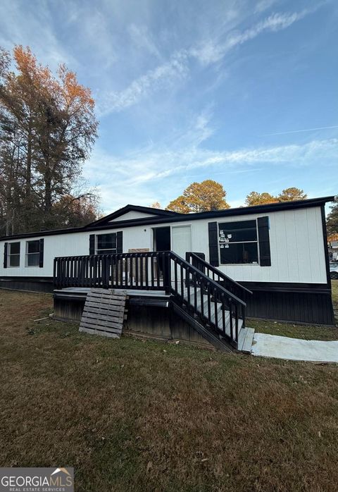 Photo of 21 CLUB Cir, Ellenwood, GA 30294 (MLS # 10655250)