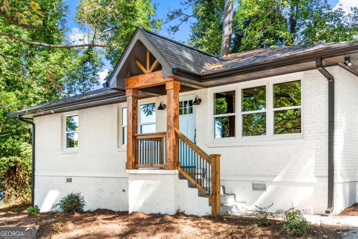 Welcome to this exquisite 3-bedroom, 2-bath residence in the heart of Decatur, where modern luxury meets timeless design. Upon entering, you'll be greeted by gleaming hardwood floors that flow throughout the open-concept living space, creating a seamless transition from the spacious family room to the beautifully redesigned kitchen-ideal for entertaining or relaxing in style. The kitchen showcases elegant finishes, sleek cabinetry, and generous counter space, blending function and sophistication. The primary suite offers a tranquil retreat with a spa-inspired bathroom and designer details. Every inch of this home reflects thoughtful craftsmanship, featuring fresh interior and exterior paint, a new roof, updated HVAC, plumbing, and electrical systems, ensuring comfort and peace of mind for years to come. The expansive lot provides ample outdoor space for leisure or gatherings, while the location offers unmatched convenience with nearby shops, restaurants, and entertainment just minutes away. Enjoy effortless access to I-285, I-85, Downtown Decatur, Avondale Estates, and Downtown Atlanta. This fully renovated move-in-ready home is the perfect blend of elegance and practicality-schedule your private tour today and experience luxury living in one of Decatur's most desirable areas. Inquire about available special financing grants for qualified first-time buyers.