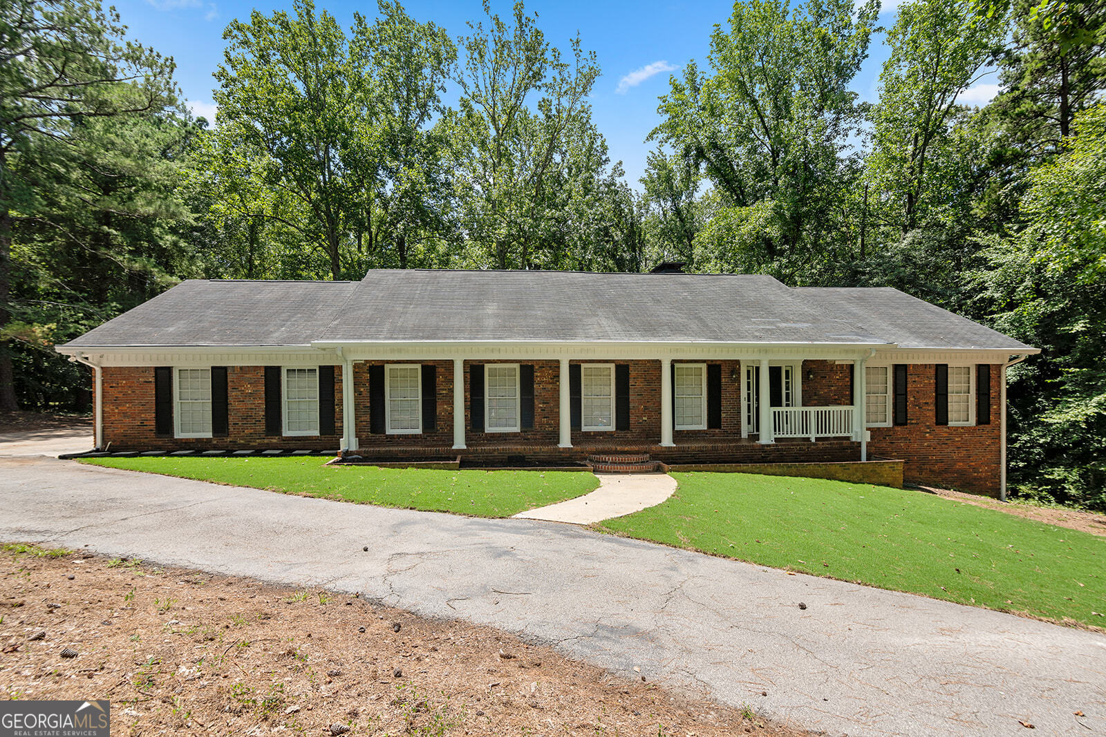 Tucked in an established Fairburn community, this four-sided brick gem offers timeless curb appeal. Perfect for a large family. Enjoy a side-entry 2-car garage, inviting front porch, private fenced backyard, and both an open deck and a screened-in back porch, perfect for relaxing year-round. Inside, discover elegant spaces including a formal living and dining room, breakfast nook, gas range, laundry room, and a finished basement with private exterior entry for added versatility. This home blends character, comfort, and convenience schedule your showing today!
