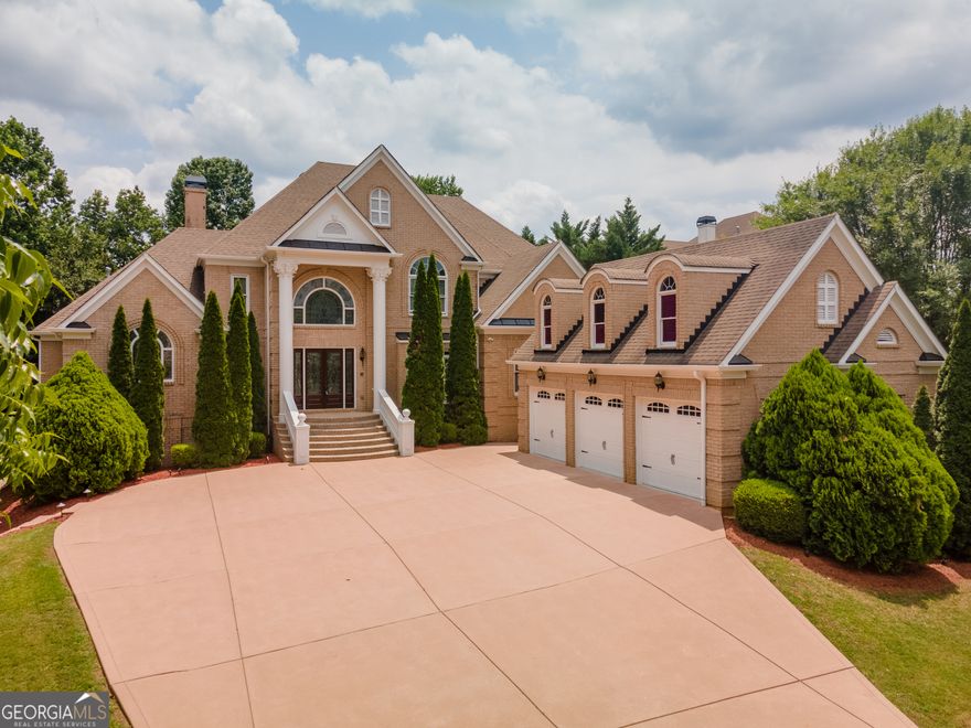HIGHLY Desirable Location!  Walking distance to Downtown Alpharetta and Avalon with Wills Park right across the street!  Luxury Estate Home in the Heart of Alpharetta, Wide driveway leads you to a 3 car garage and a Grand Front Entry.  Master on the Main with Lounge and Spa-like Suite Featuring marble mosaic flooring.  A Spiral Staircase with Iron Spindle Handrails leads to Large Secondary Bedrooms and Loft with back Staircase.  Brazilian Cherry and marble Flooring throughout the home, Chef style kitchen features granite countertops and stainless steel appliances with View to Fireside 2 Story Keeping Room and Breakfast Area.  Oversized Entertainling Family Room, Separate Dining Room, and Breathtaking Oversized 2 Story Formal Living Room. The fully finished Terrace Level has a 2nd kitchen, 2nd master bedroom, large Media Room, Bar Area with Pool Table Area, & Walk-Out Covered Patio.  Backyard Building is heated and cooled & can be used as a home office, storage, exercise area, etc.