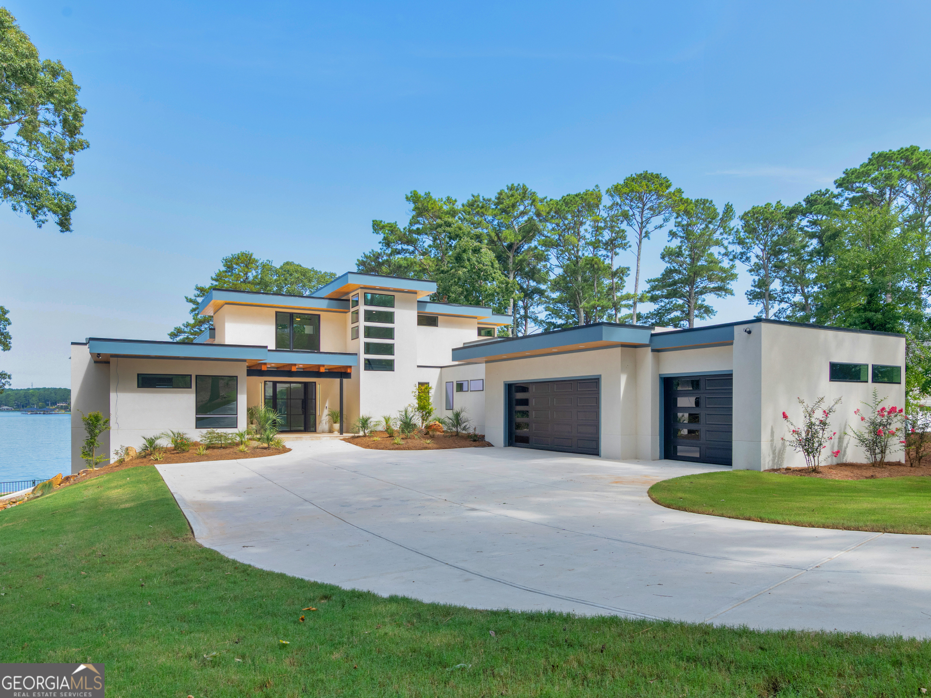 Stunning New Construction on Lake Spivey Don't miss this rare opportunity to own the only new construction available on beautiful Lake Spivey! Perfectly positioned on one of the lake's premier lots, this home boasts over 250 feet of waterfrontage, offering sweeping lake views, a private beach, two docks, and multiple outdoor living spaces designed for lakeside luxury. Whether you're soaking in the saltwater pool, relaxing in the hot tub, or enjoying sunsets from the great room, kitchen, or one of the many rooms with breathtaking views - every corner of this home is crafted for comfort and connection with nature. Lake Spivey is the only private lake of its size in the Southeast that allows water sports - including wakeboarding, wake surfing, wave runners, fishing, and more. Spend your evenings cruising the lake or simply unwinding by the water's edge. Located just minutes from I-75 and I-285, and less than 30 minutes to Atlanta Airport and downtown, this home offers the perfect blend of lakeside serenity and urban convenience. This is more than a home - it's a lifestyle. Come experience it for yourself.
