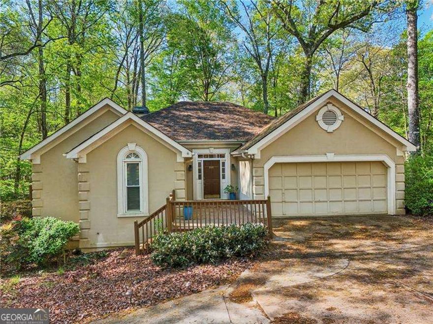 BACK ON MARKET, Buyer Financing fell thru, in the Prettiest Neighborhood just a short walk from Downtown Alpharetta!  Come live the life you have dreamed of!  Imagine living next to a creek, in a neighborhood that looks like a garden and being super close to everything DT Alpharetta has to offer!  No HOA.  No Rental Restrictions.  This home and lot have a ton of potential!  Currently on Septic but the Sewer line is close by.  This 3 BR, 2.5 BA with an office has high ceilings and a Fireplace in the Great room.  Expansive Yard, Peaceful Deck and is served by Great Schools.  Expansion would be easy as its zoned R-15 with generous setbacks.  Current owners are not required to pay for flood insurance.