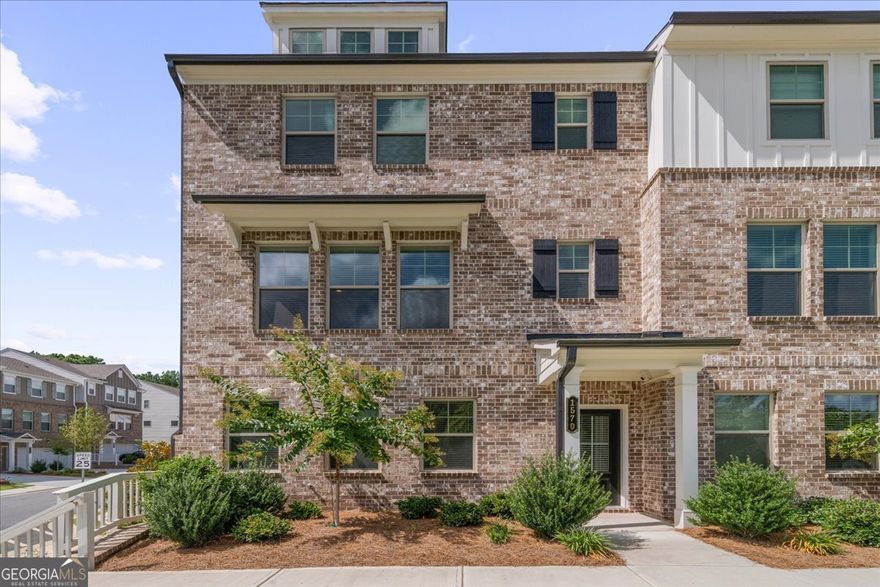 Welcome to 1570 Halbrook Pl. SW located in beautiful South Cobb! This end unit townhome is move in ready! Only 1 year with plenty of upgrades! As you enter the the home, you have a welcoming entry foyer. There is a full guest suite with full bath on the main level of the home, as well and the 2 car rear entry oversized garage. The second level of the home features an open concept family room with fireplace, eating area, and beautiful kitchen with plenty of cabinet space, granite countertops, and a large walk in pantry. There is also access to the oversized rear deck. There are tons of windows on for lots of natural light. Upstairs features an additional guest bedroom with private bath and walk in closet, full laundry room, and the primary suite with private bath, and walk in closet. The primary bath has double sinks, a private toilet room, and walk in shower. This unit has beautiful floors, great accent walls, and beautiful lights and fans through out. Faux wood blinds through out. Level private driveway. Easy walk to the community mailboxes, and firepit area. You are close to HWY 285, Truist park, Cobb Galleria, Cumberland Mall, and so much more! Call today to learn more about this great home!
