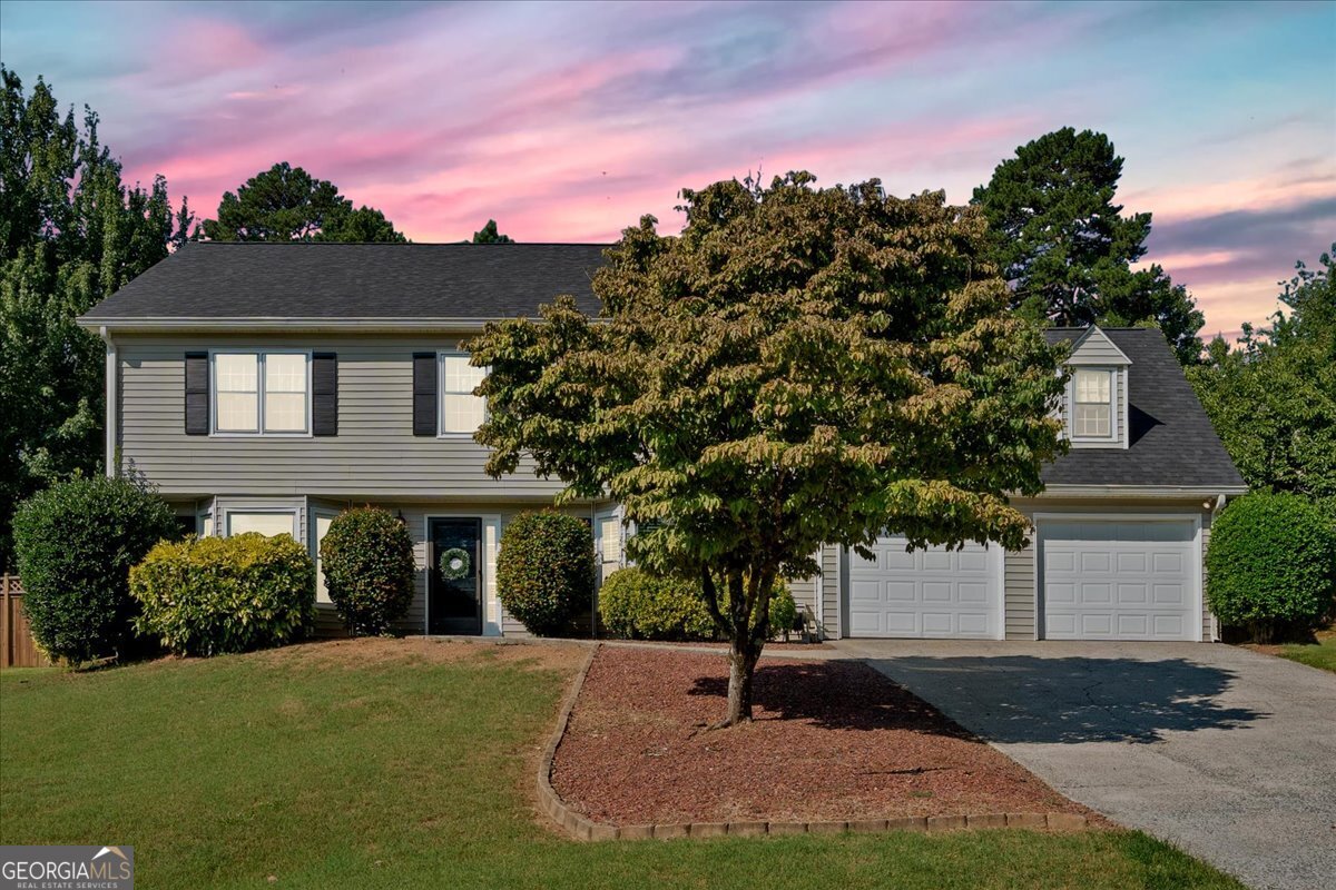 Welcome to your dream home in the highly desirable Whitfield Swim & Tennis Community, situated in the award-winning Lassiter High School District, ranked #6 among 458 Georgia high schools according to Schooldigger. This beautifully updated 4-bedroom, 3-bathroom home boasts 2,334 sq ft of spacious living, including an extra-large bonus office room perfect for remote work, hobbies, or a fifth-bedroom conversion, and his and hers walk-in closets. Step inside to find brand-new carpet all around the entire second level of the home, fresh paint throughout, and gleaming wood and tile flooring across the entire first level. Cozy up by one of two fireplaces, one in the inviting living room and another in the spacious master suite. The heart of the home is the gourmet kitchen, featuring extra-tall dark cherry wood cabinets, built-in stainless steel appliances, and a custom wine rack, a chef's dream that blends luxury and functionality. Enjoy outdoor living at its best with a private, fenced backyard featuring a gorgeous inground saltwater pool with new pumps and filters, a covered patio with an awning, and plenty of space for entertaining or relaxing. Additional highlights include a brand-new roof, two AC units for optimal comfort, Maintenance-free gutter guards, and a location directly across from community amenities: swimming pool, tennis courts, and basketball court. This move-in-ready home offers comfort, luxury, and an unbeatable location. Walking distance from Kroger, Publix, Target, and all the shopping, dining, and entertainment on the corner of Shallowford Rd and Sandy Plains Rd. Schedule your private showing today before it's gone! Recent updates as of June 2025: *new carpet installed $5,584.29 *new washer and dryer staying with the house $629.00 each, current cost to build the saltwater inground pool estimated as 32'x16' Pool, Pool Deck Brushed Concrete is totaling $110,000 and includes: VS Pump, Filter, Salt System.