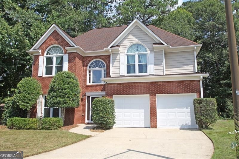 Located on a nice cul-de-sac, this home has a great open floor plan with Two story foyer that opens to the nice size Dining Room. Large Kitchen with Breakfast Bar and white cabinets with stainless appliances, built-in desk and nice size pantry. The Entire first floor has beautiful Cherry laminate flooring. The first floor also has a Half Bath and a large Utility Room that houses the washer and dryer included in the sale. Two story family room and spacious breakfast area have many windows and is very bright rounds out the first floor. Looking out the back door in Breakfast room is a nice size patio and beautifully wooded back yard. Upstairs there is a large Owners suite with vaulted ceiling and a lovely window that is so nice and bright. The owners' suite has two big closets as well as a separate tub and shower and double vanity bath include. There are two additional bedrooms on the second floor with an adjoining bath with a tub/shower combo. In addition to the bedrooms and baths on this level, there is a great loft area that could be an office or TV/game room or even a fourth bedroom. Also, this is completed by a nice large two car garage that has new garage doors.