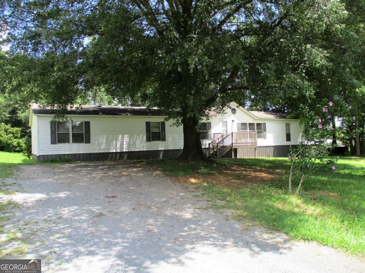 Welcome to this beautifully updated 4-bedroom (split bedroom plan), 2-bath double wide home nestled in the heart of the desirable Sonoraville area. Thoughtfully refreshed with new paint throughout and elegant luxury vinyl plank flooring, this spacious residence offers both comfort and style. The kitchen boasts brand new stainless steel appliances, perfectly complementing the home's modern touches. Set on a lovely shaded lot, the property provides a serene atmosphere while remaining just minutes from town, schools, and everyday conveniences. A perfect blend of charm, space, and location-this is a home you won't want to miss.