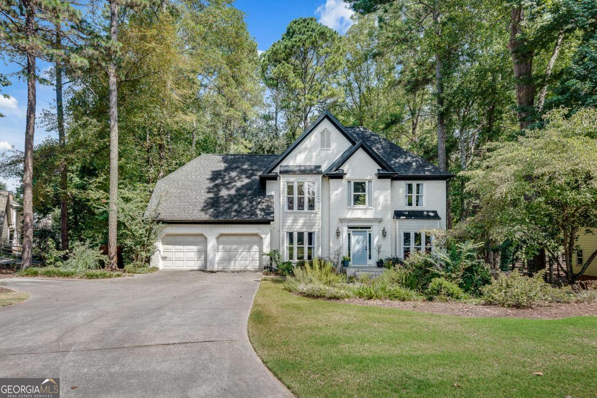 Located in a beautiful and well-maintained West Hampton neighborhood, close to highly rated Cobb County schools and just minutes from The Avenues of West Cobb, Kennesaw Mountain, and Downtown Marietta. Community amenities such as a swimming pool and tennis courts are within walking distance or a few minutes by car. This lovely features the following: 5 bedrooms/3.5 bathrooms have either walk in or built in closets and ceiling fans Oak floors throughout and carpeted stairs Living room with fireplace, study/office, dining room and foyer Kitchen and breakfast room with vaulted ceiling and large windows Sunroom with vaulted ceiling, skylights and large windows Laundry room Finished basement with windows and walk out access to garden Utility room with easy access to HVAC/electrical and extra storage space 2-car garage with remote and wall switches Small deck with stairs to back garden Irrigation system in the front yard 3,851 sqft on .89 corner plot, with gated privacy fence What's new for August 2025: New shingle roof with 10 year warranty and 25-33 year lifespan, luxury vinyl planks (LVP) flooring in basement, and water heater. All professionally installed. Improvements in last 4 years: All new windows, front and deck doors, new oak floors on second floor to match the (refinished) oak on the first level. New HVAC with water softener system and all large kitchen and laundry appliances. The open plan kitchen features quartz countertops with a waterfall edge, stainless steel appliances, and plenty of storage. The master bathroom has a double vanity, freestanding bathtub, floor-mounted faucets and a curb less shower. The finished basement features a bedroom, living room with fireplace, renovated full bathroom, a kitchenette with sink/cabinet and space for a fridge, under stair closet, new LVP floor, and a separate utility room. This home is move-in ready and has great potential to be your own!