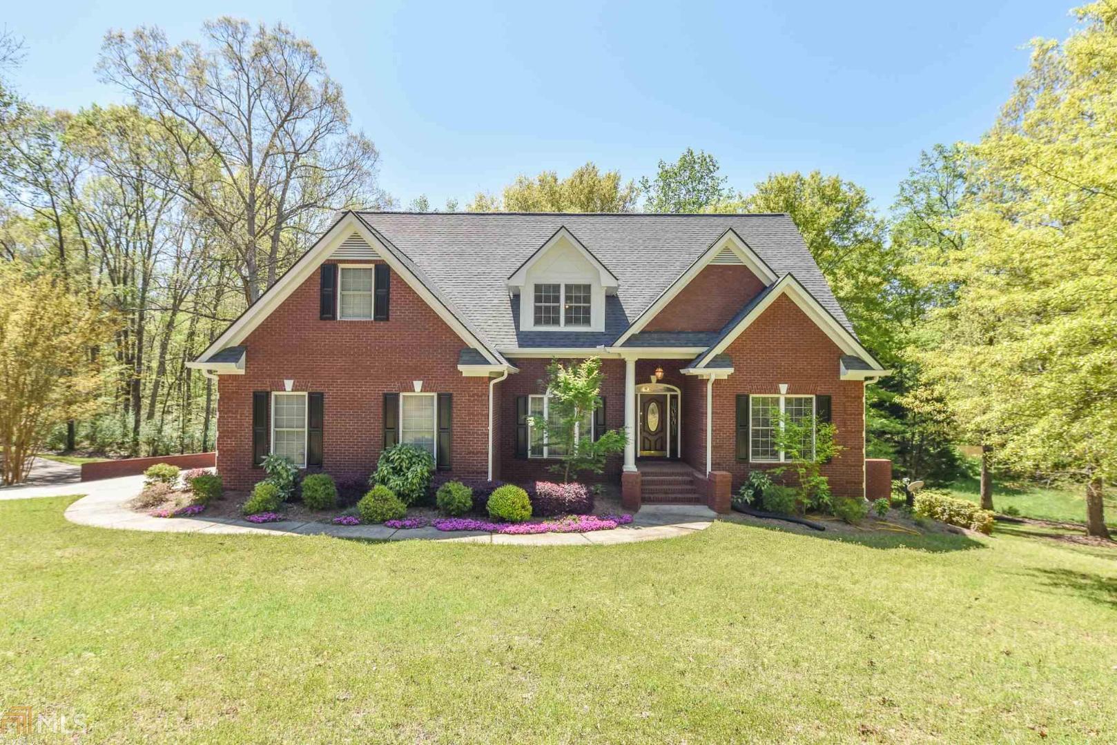 Award winning Oconee County Schools. Master on Main. Living level has hardwood floors that have just been replaced or refinished with carpet in master bedroom. Off kitchen is a screened porch for entertaining or just Watching nature. Main level includes formal dining room, family room, kitchen, laundry room/pantry and ensuite master bedroom. Upstairs level includes three bedrooms and 2 full bathrooms. Basement has large size bedroom, full bathroom, living area and separate room that could be used for office etc. Basement level has separate entrance for outside and could be converted to a separate in-law suite. Home has a two car garage at main level and a 3rd garage at basement level. This room measures 29.5' by 14 3/4 and has been used as a workshop. There is an adjoining small room 20.5' by 4.8' that is currently used as an extended Workshop and has a double door access to outside. Zoning allows for two or so horses. A perfect home to live, work and play!