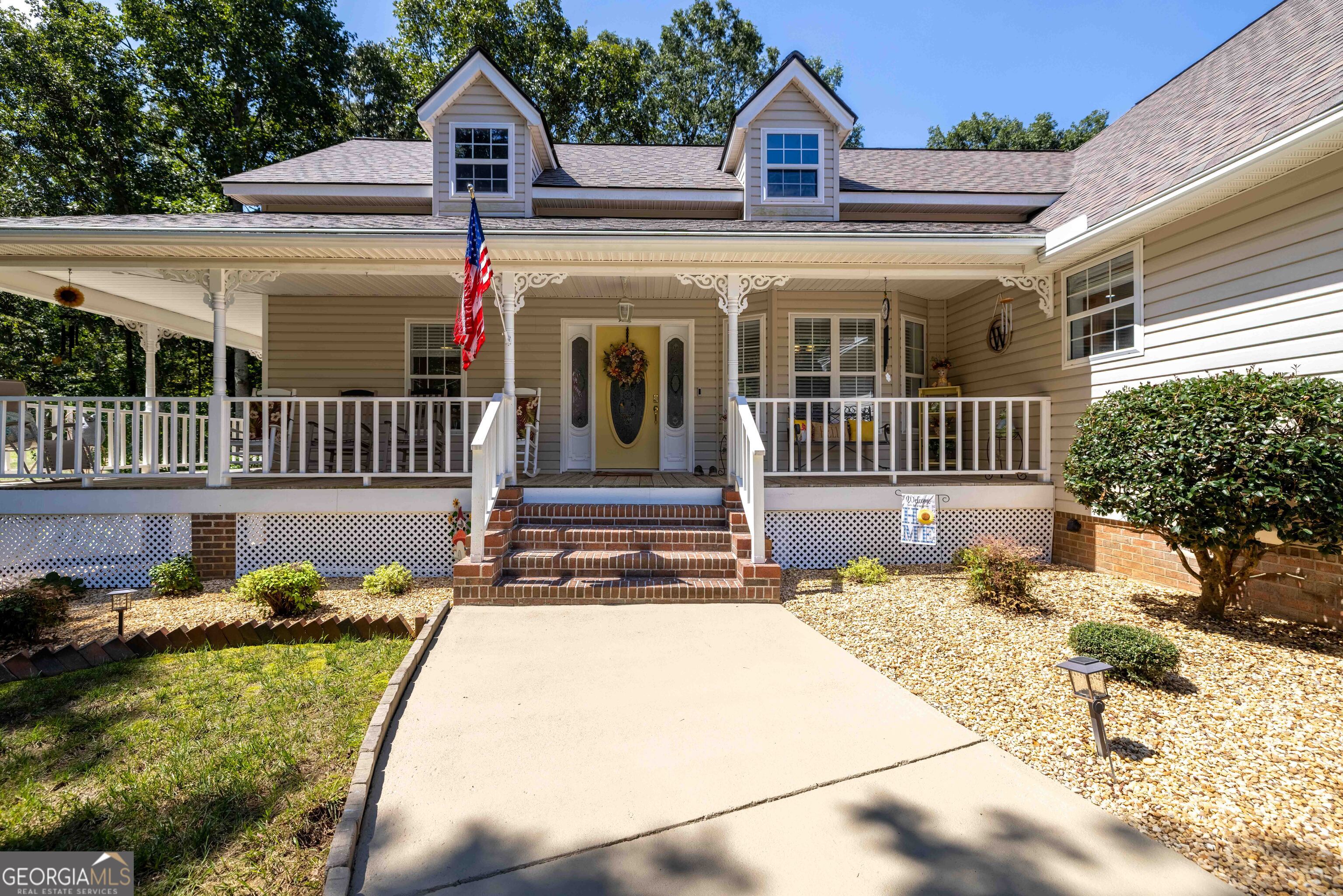 Exceptional North Hall county home, with corner lot. This meticulously maintained home has so much to offer. Starting with a Rocking chair front porch. as you enter, the main level features a large foyer and separate dining area. Large primary suite with office and walk in closet is located on the opposite side of the secondary bedrooms and bath. Large kitchen with refinished solid oak cabinets and tile flooring. Spacious laundry room off the kitchen with added storage. Access to the two car garage is also off the kitchen. Large family room with fireplace and cathedral ceiling is a great place to relax and unwind. The Recently renovated sun room off the main living is a great place for morning coffee, with it's three walls of windows and separate HVAC mini split system. The terrace level recently renovated make it ideal for generational families with a large bedroom and closet, kitchenette, dining and sitting area, washer and dryer closet and new LVP flooring through out. Separate entry with it's own driveway. Additional storage space in the unfinished portion, with inside and outside access. New out building with windows and double doors for storage, lawn equipment or work shop. Also recently installed, Leaf Guard gutter system with lifetime warranty. All this and priced below recently appraised value.