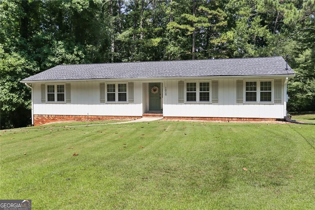Absolutely wonderful RENOVATED RANCH sought after close in Woodstock! RENOVATED oversized kitchen with granite counter tops, stainless steel appliances, custom cabinetry and more! Formal LR/office, great dining room, cozy family room with fireplace. Completely RENOVATED BATHS, Updated ROOF, Updated HVAC, Updated PLUMBING throughout house. Portion of the basement has been finished, waterproofed, and sealed. Custom heart of pine staircase to lower level with media/family room - could be used as a home office or 4th bedroom! Must see to believe! Large guest bedrooms, hardwood flooring throughout home! Workshop/Utility/Laundry Room! 2 car garage & large private deck overlooking level Fenced yard