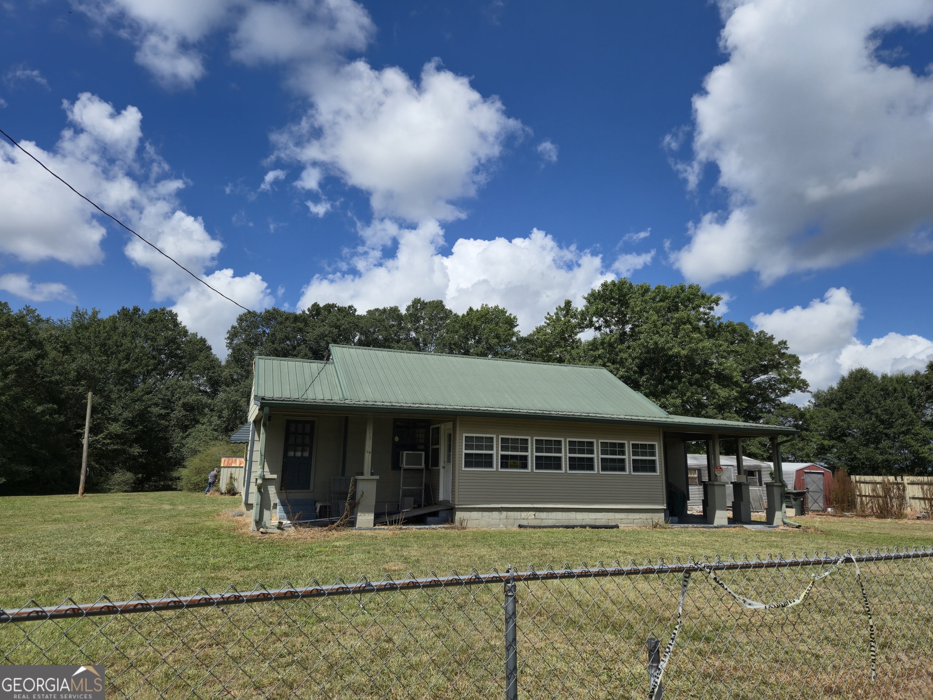 Great opportunity to buy this 3.09 Acres to Renovate, Develop or Build your Dream Home in Cobb Co. and only minutes from growing Powder Springs-Lithia Springs and Austell. Property includes three outbuildings perfect for Workshop or Storage.