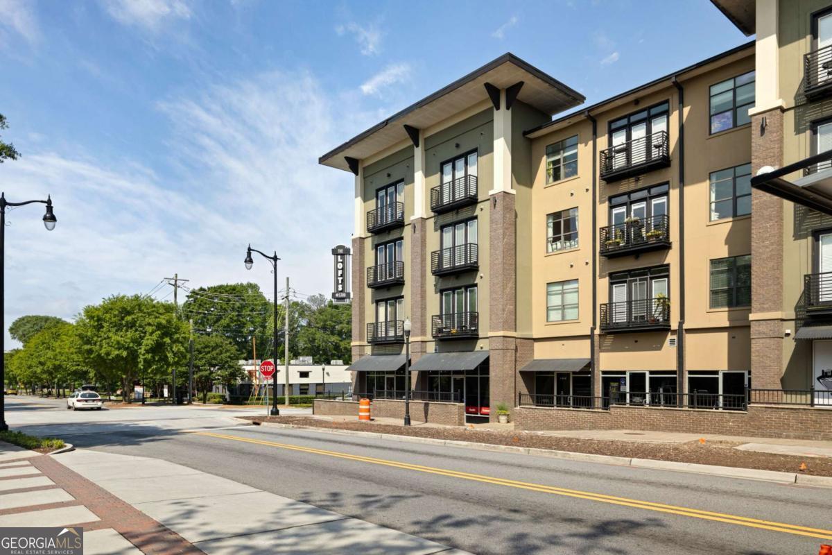 Renovated 1BR, 1BA Loft unit on the top floor overlooking courtyard in sought after Lofts @5300 in Chamblee across from the Chamblee Marta Station! Great Island Kitchen with white cabinetry, tile backsplash, stainless steel appliances & Quartz countertops! Gorgeous bath with tile floor, large tile shower, tub with tile surround, vanity with stone counter-top, & spacious walk-in closet. Hardwood floors in the Kitchen & living room. Balcony off living room overlooks the courtyard. New carpet in the bedroom. This unit comes with one covered parking space and a storage unit! Enjoy the convenience of urban living with quick access to public transportation and an abundance of shopping and dining/bar options!! This complex is FHA & VA approved. The rental cap has been met.
