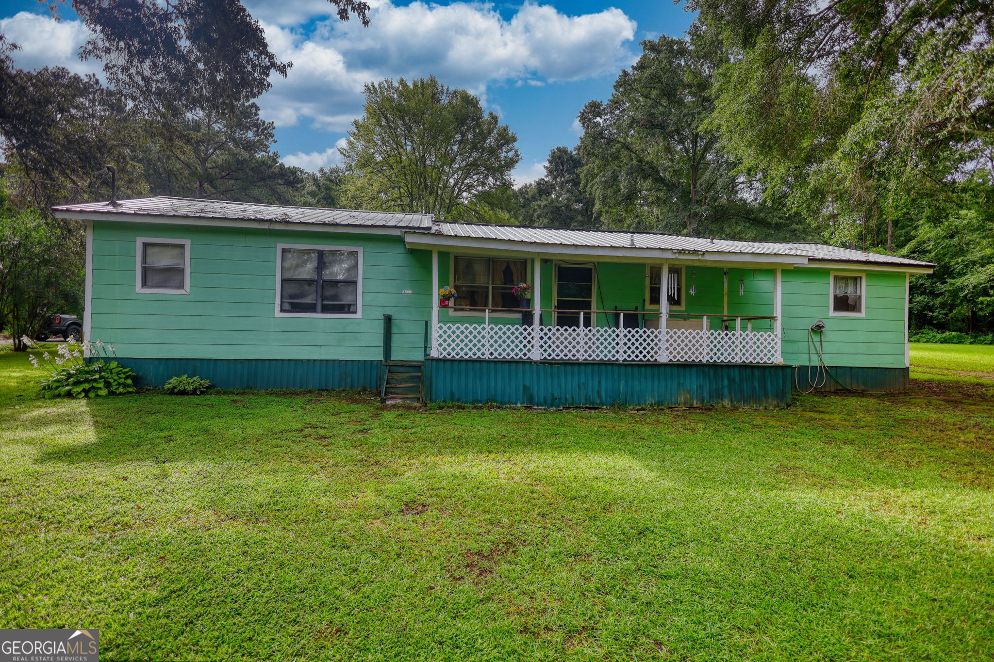 Welcome to 85 Macon Street- a single-family home tucked in the heart of Monticello, Jasper County. Three additional parcels are included in this listing. One street over from the lake, has a boat ramp, easy to access. As is, perfect for someone who wants to live near the lake. For families or investors, this could be a perfect offering. The home's size, layout, and location make it suitable for renovation, rental, or as a comfortable primary residence. This property offers a unique opportunity for a motivated buyer to add value and make it their own.