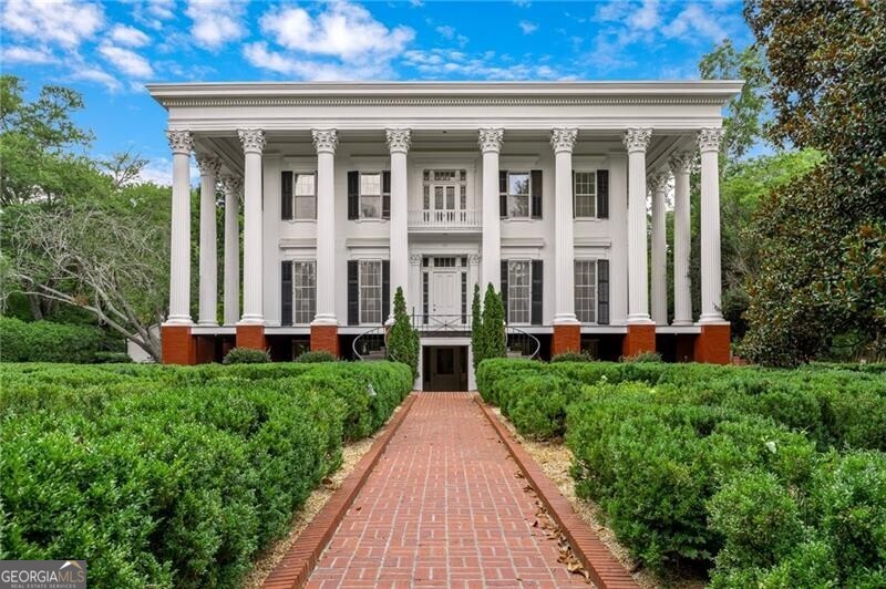 Welcome to 570 Prince Avenue, notably known as the University of Georgia's President's House and an important part of Athens' history. Listed on the National Register of Historic Places, this distinguished landmark is being offered for sale for the first time. Meticulously maintained and updated, while keeping its timeless historic charm, this iconic home is nestled on approximately five acres along the tree-lined streets near downtown Athens. Over the decades, thousands of people have attended events here, and until recently, it has always been home to the University's President. Constructed in the 1850's, this home has so much architectural significance, showcasing period elements and meticulous craftsmanship, and many of the original details inside and outside of the home remain. From the famous gardens to the expansive wraparound porch, every corner of 570 Prince Avenue whispers stories of generations past, inviting new owners to become part of its enduring legacy. Inquire to learn more about the protective easement and zoning.