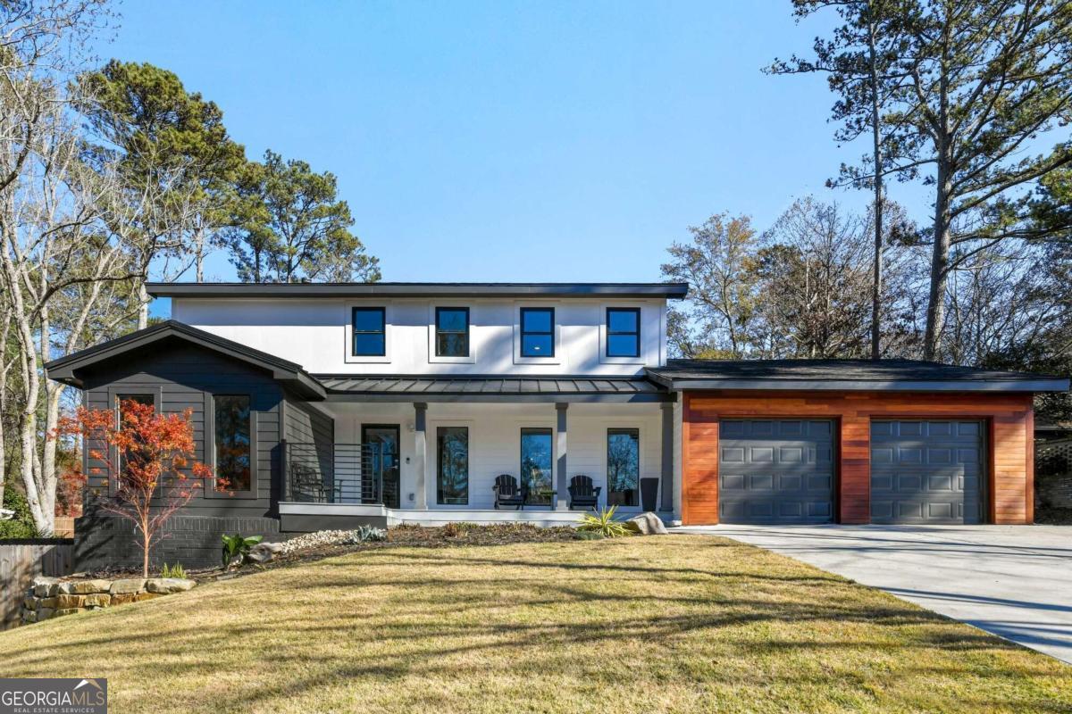 Presenting Kings Cove's poised gem that captivates a blend of practical sense and contemporary allure! As you drive up, admire the curb appeal with the Brazilian accent hardwood siding and welcoming front porch. The .45 acre land has undergone a comprehensive facelift. From 14 cleared trees, to leveling of the backyard, fencing, sod installation, retaining wall, exotics plants, and new driveway, no rock was literally left unturned. Before new siding was placed to the facade of the property, the high end insulation and brand new sheathing was installed. Upgraded gutters were just installed in front. Priced below the recently appraised value, this 5 bedroom, 3.5 bathroom home has a sprawling 3593 square feet and an expansive new 30' x 15' Trex deck for more entertaining space. Inside, the property has all-new plumbing from copper to PECS, new fixtures, new hot water heater, and new PVC drains. The main level is adorned with new paint, newly tiled gas fireplace, while the new front windows flood the interiors with natural light. The new open kitchen is a culinary masterpiece, featuring beautiful quartz waterfall counters, new cabinets, and a suite of new appliances, including a new fridge gas cooktop, hood, and double ovens. A guest bedroom and full bathroom are easily accessible on the main level. The laundry room and powder room is off of the kitchen. The luxurious living experience extends to the outdoor spaces with a bi-fold door to deck. Enjoy a glass of wine on your comfortable screened-in porch with 282 sf of tile, vaulted ceiling, convenient electrical outlets, and two new skylights. Upstairs, explore the 4 bedrooms and 2 full bathrooms. The primary en-suite is spacious with a custom walk-in closet and updated tiled bathroom. The property also boasts a full finished basement, offering versatile living spaces for a myriad of activities. Residents of the community are treated to an array of amenities, including a nature trail, pool, tennis courts, playground, and a serene pond. With top Cobb County schools, Sope Creek Elementary, Dickerson Middle, and Walton High, this home offers an exceptional opportunity to fully embrace East Cobb living.
