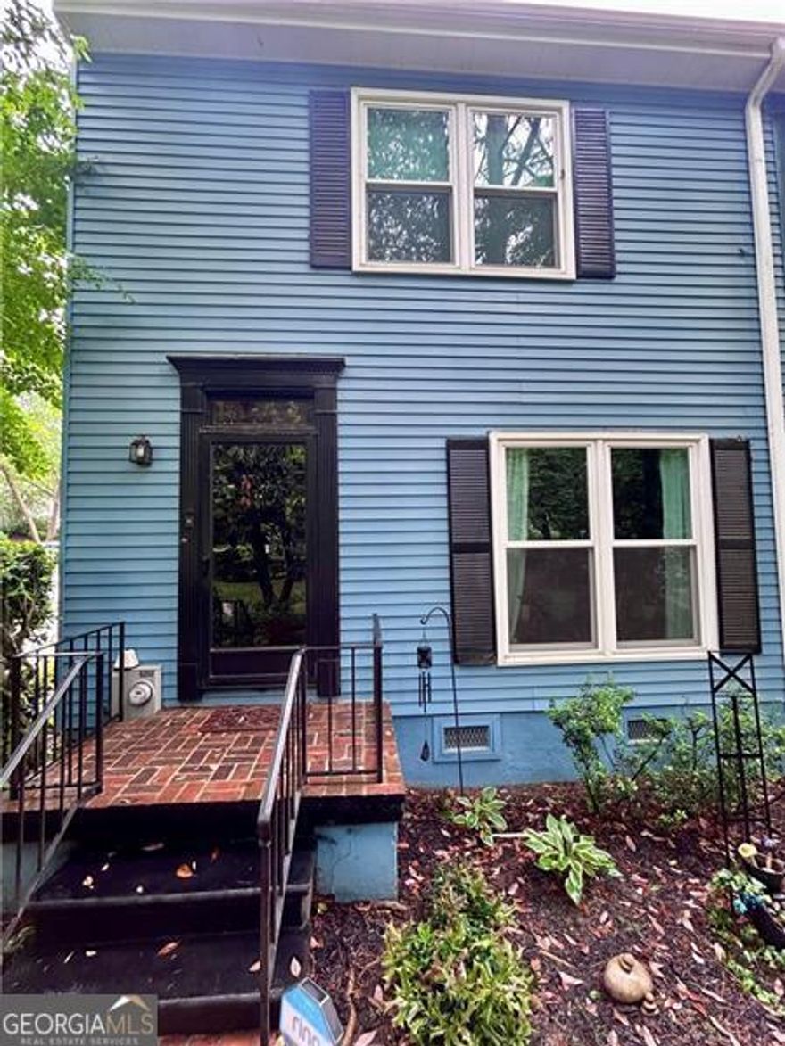 Want to be close to Marietta Square? This is a must see Unit at  Queensbourough Square Town homes. Wonderful end unit close to the pool  with three bedrooms and two full baths. This townhome has lots of  character with arched doorways and a a touch of vintage flare. Hardwood  floors through out, Separate dinning room overlooking the creek and  beautiful landscaping. Kitchen has a a beautiful custom made built in bar!  Family room with hardwoods and electric fireplace and overlooks a private  fenced courtyard with a brick patio. Upstairs has three good sized bedrooms  and laundry room. Two car garage .The community has beautiful brick  walking paths,two little bridges, two clubhouses, swimming pool and tennis  court. So close to Laurel Park, Kennesaw Mountain. Marietta Square,  shopping and restaurants. New windows through out 2023, new shutters,  Crawl space encapsulated, air ducts and dryer vents cleaned, custom bar,  new garage door springs, new dishwasher, Refrigerator & stackable washer  and dryer included. Transferrable home warranty with American Home Shield.
