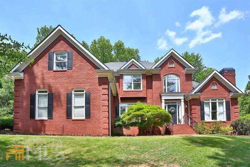 This home is a must see!!! Fully renovated 4 sided brick executive estate home. Updated Gourmet kitchen with white cabinets, white quartz countertops, KitchenAid stainless steel appliances, large open view to keeping room and breakfast room. MASTER ON MAIN with renovated master bath, custom closet system and private sitting room with fireplace. Large open floor plan with plenty of living space, hardwood floors throughout the main level, separate dining room, two story entry foyer, two story great room with custom mill work and fireplace. Amazing walk out backyard oasis, level back brick patio, garden area and play area. Private front yard with a creek on a cul de sac lot. Partially finished basement with additional bedroom, family room and workout area. Award winning public schools!