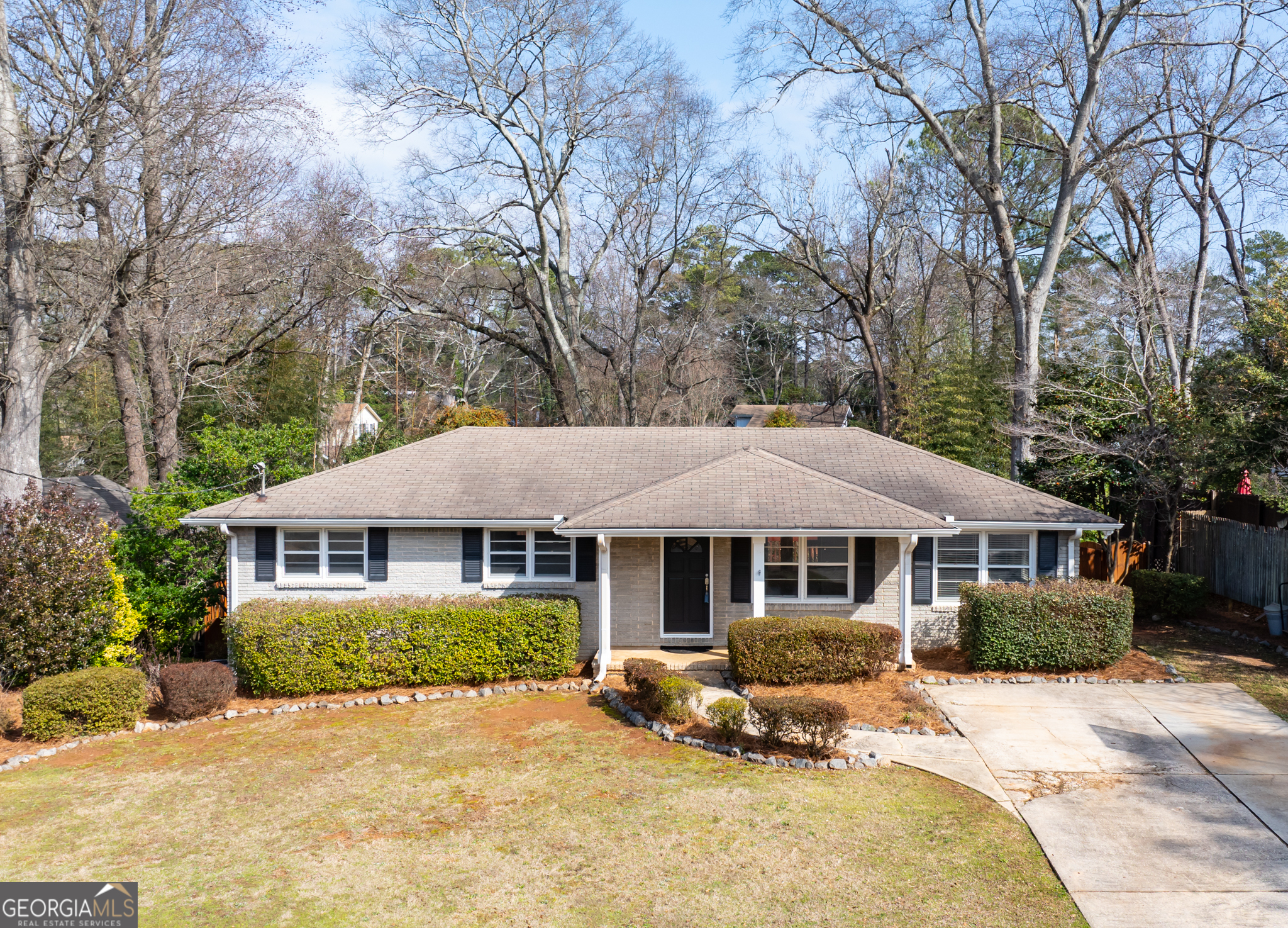 Located in the desirable Hudson Woods community, this charming 3-bedroom, 1-bathroom single-story traditional ranch home offers an inviting blend of comfort and convenience. The home is strategically positioned near top-rated schools, diverse shopping options, excellent dining, and has quick access to major highways like I-85 and I-285. Key Features include * Character & Charm: Bright spaces with hardwood floors throughout. * Modern Kitchen: Updated with stainless steel appliances, granite countertops, and a breakfast bar. * Outdoor Delight: Easy access to a stunning large deck that overlooks a beautiful private fenced-in backyard, complete with a children's play center and ample space. * Expansive Lower Level: Discover a spacious daylight basement with a game room, built-in storage closet, laundry, workshop, and exterior entrance. There is potential to transform the game room into a home theatre! This home is perfect for immediate move-in. Don't miss this unique opportunity to lease a home in an unbeatable location.