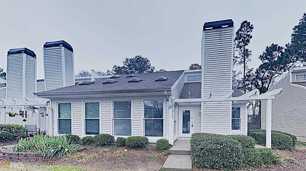 Vacant! Come see this three bedroom townhome in Planters Ridge! This home offers fresh interior paint, new luxury vinyl plank flooring on the first floor and new carpet upstairs. Cozy up with the fireplace in the living room. The kitchen features new granite countertops and new stainless steel appliances. Enjoy the sun room off the back of the dining room as an extra entertaining space. The master bedroom is located on the main floor for added privacy. The master ensuite bathroom has dual sinks and a walk in closet. A private fenced patio outside to enjoy your morning or evening beverage of choice. Located close to downtown Alpharetta, shopping, dining, and highways. Don't miss this one!