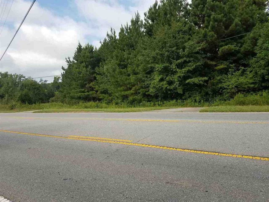 +/- 21.54 ac  Potential Commercial Land with +/- 687 ft. of road frontage  on busy Jackson Rd (Hwy 36).  Estate owned. Motivated seller.  Bring all offers!