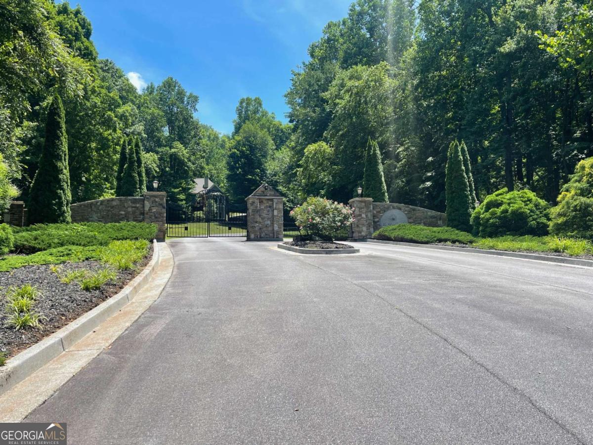Beautiful Gated Community minutes to town in Hiawassee and Lake Chatuge. Underground Utilities, Public Water, High Speed Internet and Paved Roads. Minimum SQFT for new builds is 1800 SQFT Heated and Cooled for one story or 1400 on mail level if a two story home. This is a nice private small mountain community with a fabulous location close to shopping and town. Lot15 will have gorgeous year round mountain views when cleared for a house site. Enjoy this Beautiful Mountain Community that is minutes to Lake Chatuge and the town of Hiawassee