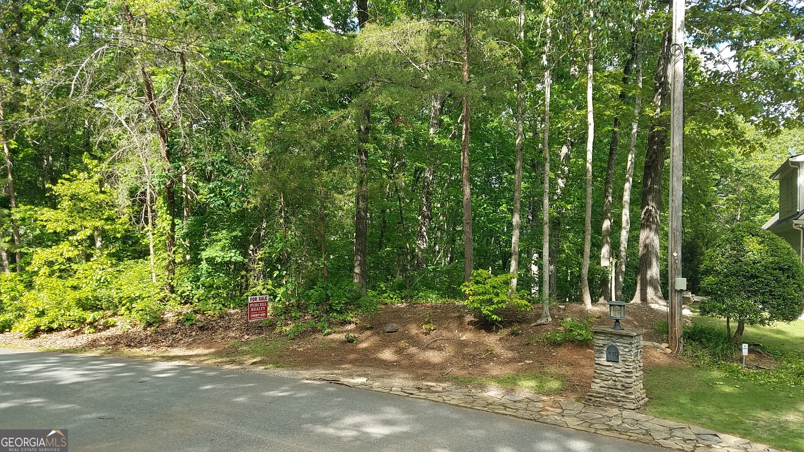 Estate Sale. Lake Lanier frontage - located in Lake Harbor Shores. No HOA. Minutes from Little Hall Park & boat ramp access. Just off Hwy 53 and minutes from Gainesville, Ga. Paved road frontage & public water available. Great tract for a Cabin with basement.