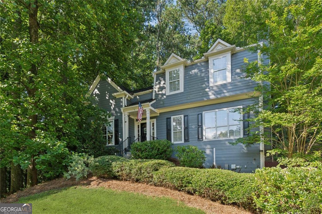 Located in a quiet cul-de-sac, this 4-bedroom, 2.5-bath home offers space, privacy, and a fantastic location close to Kennesaw, Woodstock, Marietta, and Lake Allatoona. It's also just minutes from Kennesaw State University with easy access to I-75 and I-575-ideal for commuters, students, and families alike. The home features new flooring on the main level, a vaulted foyer and great room, a formal dining room, and an eat-in kitchen with stainless steel appliances, including a gas range and French door refrigerator. The spacious primary suite offers a comfortable retreat, while the finished basement provides flexible space perfect for a home theater, playroom, or office. Step outside to a large two-level deck overlooking a private, wooded backyard ideal for entertaining or relaxing. The home includes Hardie siding and a recently replaced HVAC system. Optional pool membership available! If you're looking for a well-maintained home with great bones and a hard-to-beat location, this one checks all the boxes.