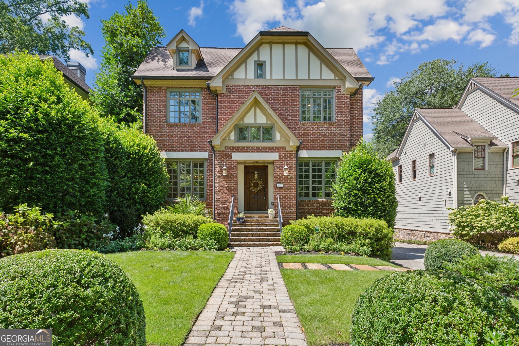 Gorgeous and stately John Willis Tudor style home in Ardmore Park with stunning renovations by Mosaic Designs and interiors by Mallory Mathison Inc! This well-maintained home features a large, updated kitchen with new countertops, new hardware, new refrigerator, new microwave, new refinished cabinets, as well as new light fixtures which are also found on the main and upper levels. The kitchen opens up graciously to a spacious family room and functional screened porch overlooking a private fenced and turfed backyard. Newly refinished hardwood floors throughout the main level and in the huge primary suite on the upper level that offers a separate sitting area with dual closets. A 2-car garage, full finished basement with exercise room, storage room and private guest suite are on the lower level. The lot includes the cleared-out space beyond the garage which provides ample opportunity for future expansion. Location is truly superb - moments from Piedmont Hospital, Ardmore Park, Tanyard Creek Park, easy access to the BeltLine, Bobby Jones, shopping, restaurants, and many more amenities nearby.