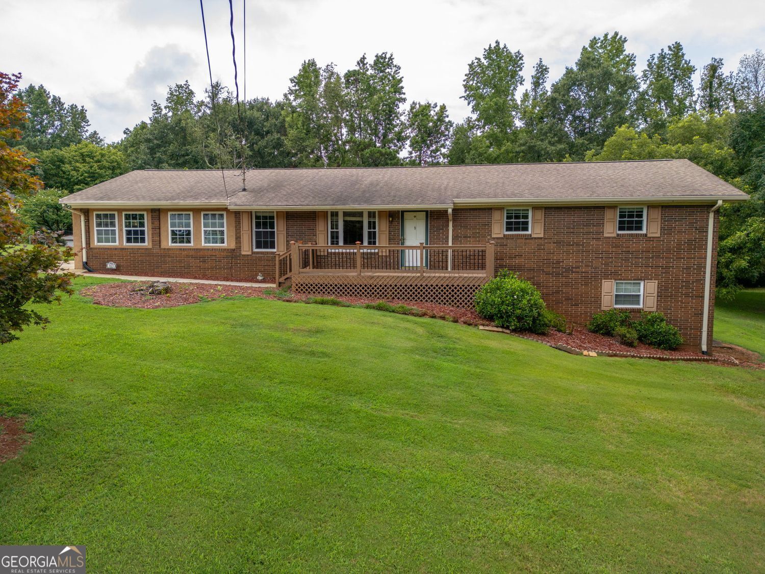 Welcome to 5025 Pleasant View Circle - where charm, comfort, and space all come together. This 3-bedroom, 2-bath ranch sits on a generous .69-acre lot tucked into a peaceful cul-de-sac community with no HOA. From the moment you step onto the inviting front porch, you'll feel right at home. Step inside to an open-concept layout perfect for relaxing or entertaining. The living room features a cozy fireplace and connects seamlessly with the kitchen and dining area. Hosting get-togethers or movie nights? You'll have room for it all. This home offers flexibility, thanks to Laundry Hookups- one on the main level and one in the basement. Speaking of the basement, it's partially finished with space for a playroom, media area, or home gym. There's also unfinished space ideal for storage or future projects. Parking is easy with a two-car garage and extra-wide driveway, perfect for guests. But the real gem is the 20x40-foot in-ground pool, 10.5 feet deep with a diving board and slide. Whether you're relaxing poolside, enjoying the screened-in porch, or sipping sweet tea on the front porch, you've got outdoor options for every mood. Located in the sought-after new Everwood Elementary School district, this home blends space, function, and location. Come see how easy it is to picture life here - schedule your showing today!