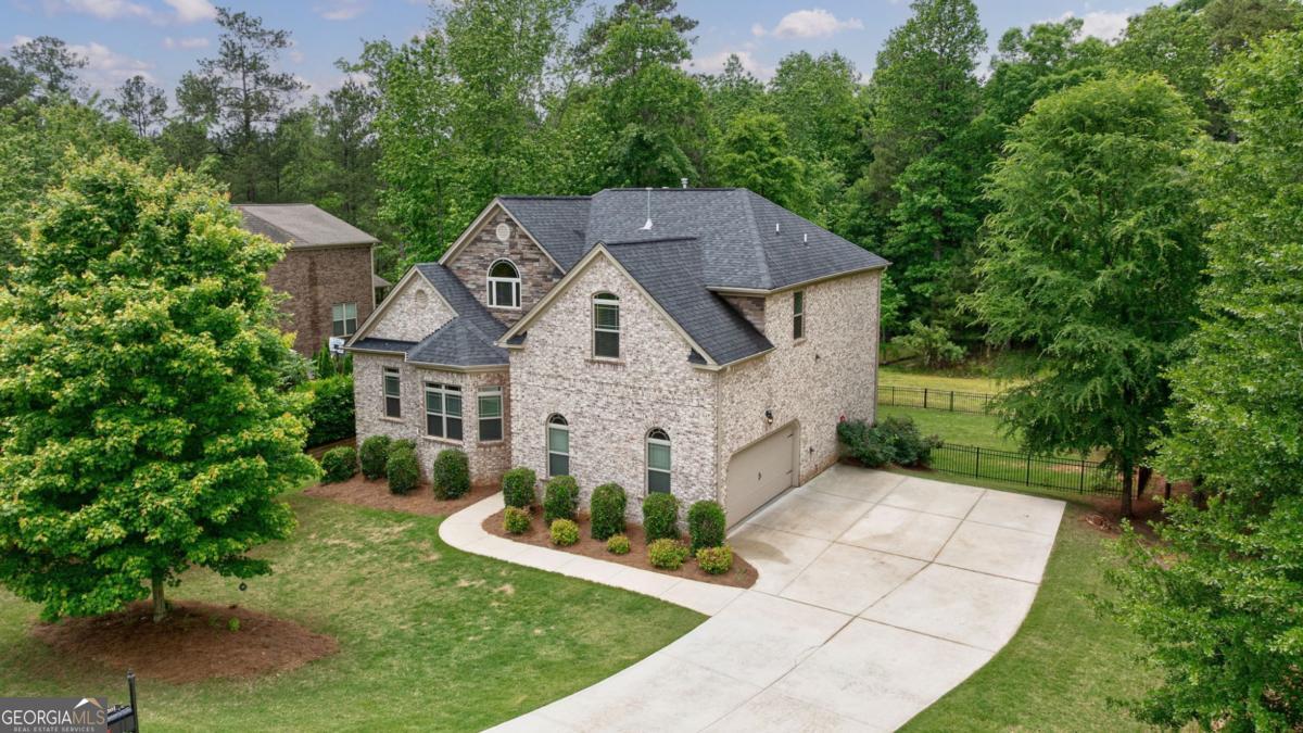 *** Freshly Painted Kitchen! *** Located in the highly sought-after Lane Creek neighborhood and zoned for top-ranked North Oconee schools, this 4-bedroom, 4.5-bath home sits on a rare double lot-offering 2 acres of privacy and space. With this much land and a finished basement at this price point, opportunities like this are hard to come by. Inside, you'll find a spacious, well-designed layout featuring four bedrooms, all generously sized with tall ceilings and walk-in closets. An upstairs loft provides excellent flex space-perfect for a playroom, home office, or second living area. On the main level, upgraded hardwood floors bring warmth and character throughout the central living spaces. The kitchen has been freshly painted in a neutral tone that seamlessly complements the rest of the home's interior, creating a cohesive and inviting space that's move-in ready. The finished basement expands your living options even further with a movie room, game room, office, and a private room with an attached bathroom-offering great potential for a 5th bedroom. You'll also find both finished and unfinished storage areas, making it easy to stay organized. Step outside to enjoy the new concrete patio and the fenced portion of the expansive backyard-an ideal space for pets, play, or outdoor entertaining. Beyond the fence, the wooded lot provides added privacy and natural beauty, with frequent deer sightings. Homes offering a **double lot, finished basement, fenced yard, and 5th bedroom potential-at this price point-**are a rare find in Lane Creek. Don't miss your chance-schedule your showing today!