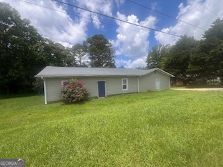 ***INVESTMENT OPPORTUNITY - 2 PARCELS TOTALING 2.81 ACRES*** This unique sale includes two adjoining parcels offering a combined total of 2.81 acres on the corner of HD Atha Road and Jersey Monroe Road: Parcel C0780-036: A green home, said to be built in 1956, on 0.39 acre. Parcel C0780-037: A yellow home originally built in 1900, situated on 2.42 acres. Both homes require extensive renovation or may be candidates for demolition to make way for new development. These parcels offer great potential for investors, builders, or visionaries looking to reimagine the property. Once combined, this corner lot offers a substantial 2.81-acre footprint. According to county planning, the area has been referenced as potential commercial-buyer to confirm directly with the county. ***Important Property Details, Utilities:** Neither home currently has water service. A shared well from a neighboring property once serviced both homes, but is no longer operational. There are two wells on the property-it is the buyer's responsibility to inspect them or choose to tap into county water. The yellow house does not have power at this time, but the seller will restore power for inspections upon request. Condition Notes * The green house has experienced recent rainwater intrusion, cause appears to be a misguided gutter. The seller does not know how long the issue persisted, as the property was tenant-occupied and never reported. A new termite bait system has been installed on the green house and includes a transferable bond. ***Access & Showing Instructions*** Showings by appointment only. Must be accompanied by a licensed real estate agent.*******All parties must sign a Hold Harmless Agreement before entering the property.******* Please see documents and both the client and agent must sign and email to list agent in order to get a confirmed appointment thru showing time. The second parcel (C0780-037) is also listed under GAMLS #10548111 and will be conveyed with the purchase of this listing. Buyer is responsible for all inspections, due diligence, zoning verification, and utility research on both parcels that convey with this sale. THIS IS A CASH ONLY PROPERTY.