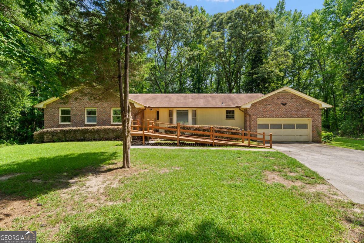 Welcome to 4967 Macland Road. Located on 2.49 private acres, this home has endless potential. This all brick, ranch style home allows for comfort, while the large unfinished basement provides a flex space for a workshop, additional storage, and direct access to the backyard. In addition to the walk out basement, there is a large deck and screened in porch perfect for entertaining. The large family room, dining room, and separate den allow everyone to feel connected while still having their own space. 4967 Macland Road is filled with endless opportunities to imagine and design and make this house your own.