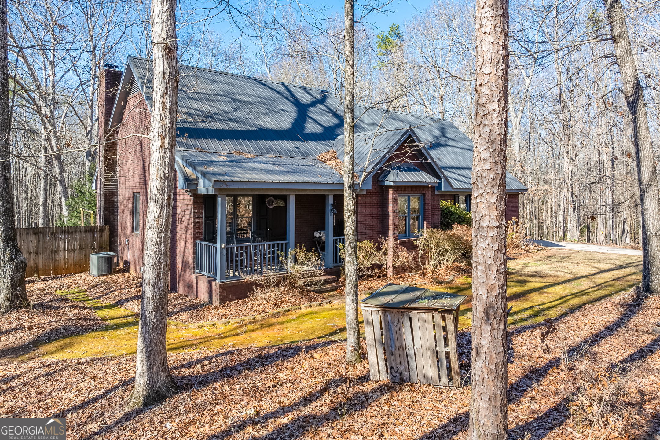 This charming 4-sided brick home with two-car attached garage, offering a serene retreat with ample space. The residence features 2 bedrooms and 2 bathrooms, with a fully expandable second floor, providing potential for additional bedrooms and living areas. The property boasts three streams, enhancing its natural beauty, and includes a new above-ground saltwater pool for relaxation. Built with 2x6 walls, the home ensures durability and energy efficiency. Additionally, the estate includes a barn and several outbuildings, offering versatility for storage, hobbies, or agricultural use. Jackson EMC good sense home. A perfect blend of privacy, comfort, and potential located continently between Jefferson and Athens. *Seller own two adjoining tracts and is willing to sell house and 8 acres or priced to sell with 22.19 acres.*
