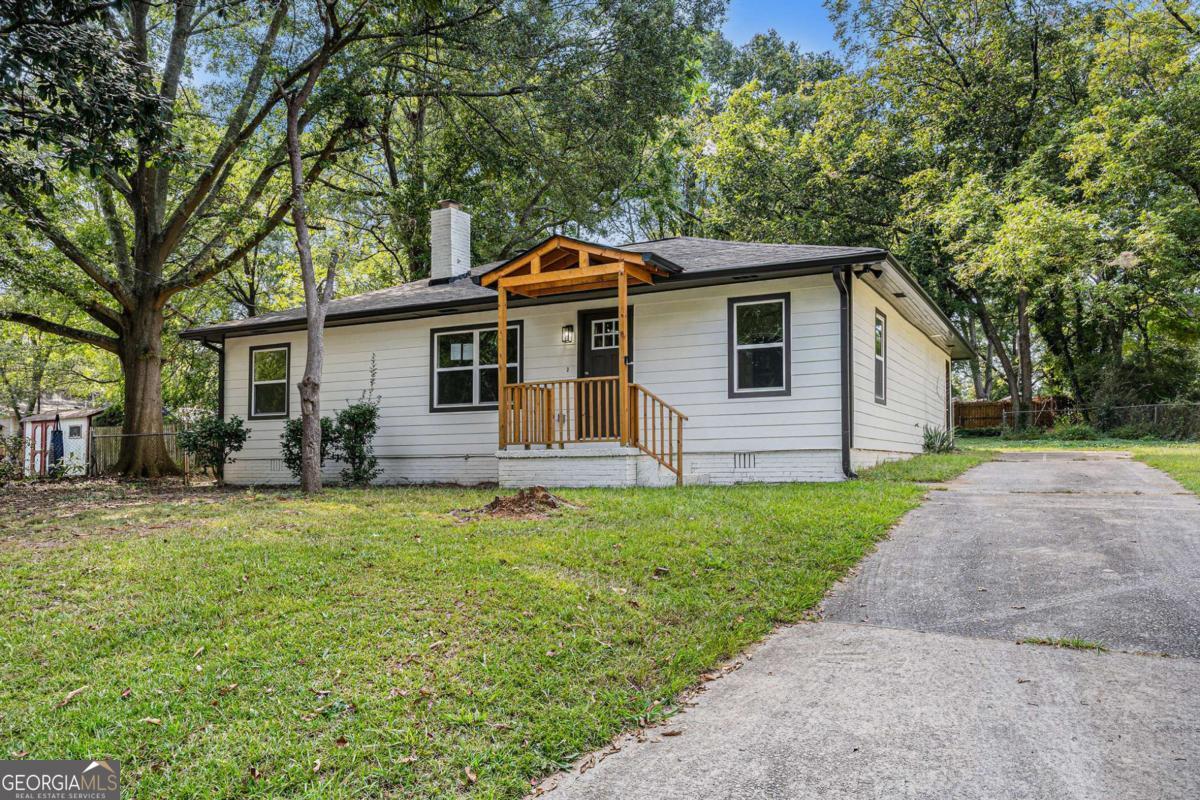 Modern upgrades meet everyday comfort in this fully renovated Forest Park home featuring 3 bedrooms, 2 bathrooms, and a versatile bonus room with endless possibilities. Whether you need a private home office, playroom, workout space, or extra guest suite, this home adapts to your lifestyle with ease. Step inside to an inviting open floor plan filled with natural light. The living room showcases fresh flooring, recessed lighting, and a beautifully updated stone fireplace that creates the perfect gathering spot. The kitchen is a showstopper with white shaker cabinets, quartz countertops, stainless steel appliances, subway tile backsplash, and a large center island that makes cooking and entertaining effortless. Both bathrooms have been completely remodeled with modern finishes, new vanities, and sleek tile work, offering a spa-like experience every day. The primary suite provides comfort and privacy, while the additional bedrooms give plenty of flexibility for family, guests, or hobbies. Outside, the leveled backyard is a true highlight, ideal for entertaining, gardening, or creating your own outdoor oasis. With space to relax and room for play, it is a yard designed to be enjoyed year-round. Every corner of this home has been thoughtfully updated, including flooring, lighting, fixtures, and paint, making it completely move-in ready. Perfectly located near schools, shopping, dining, and major highways, this home delivers both style and convenience in one complete package.