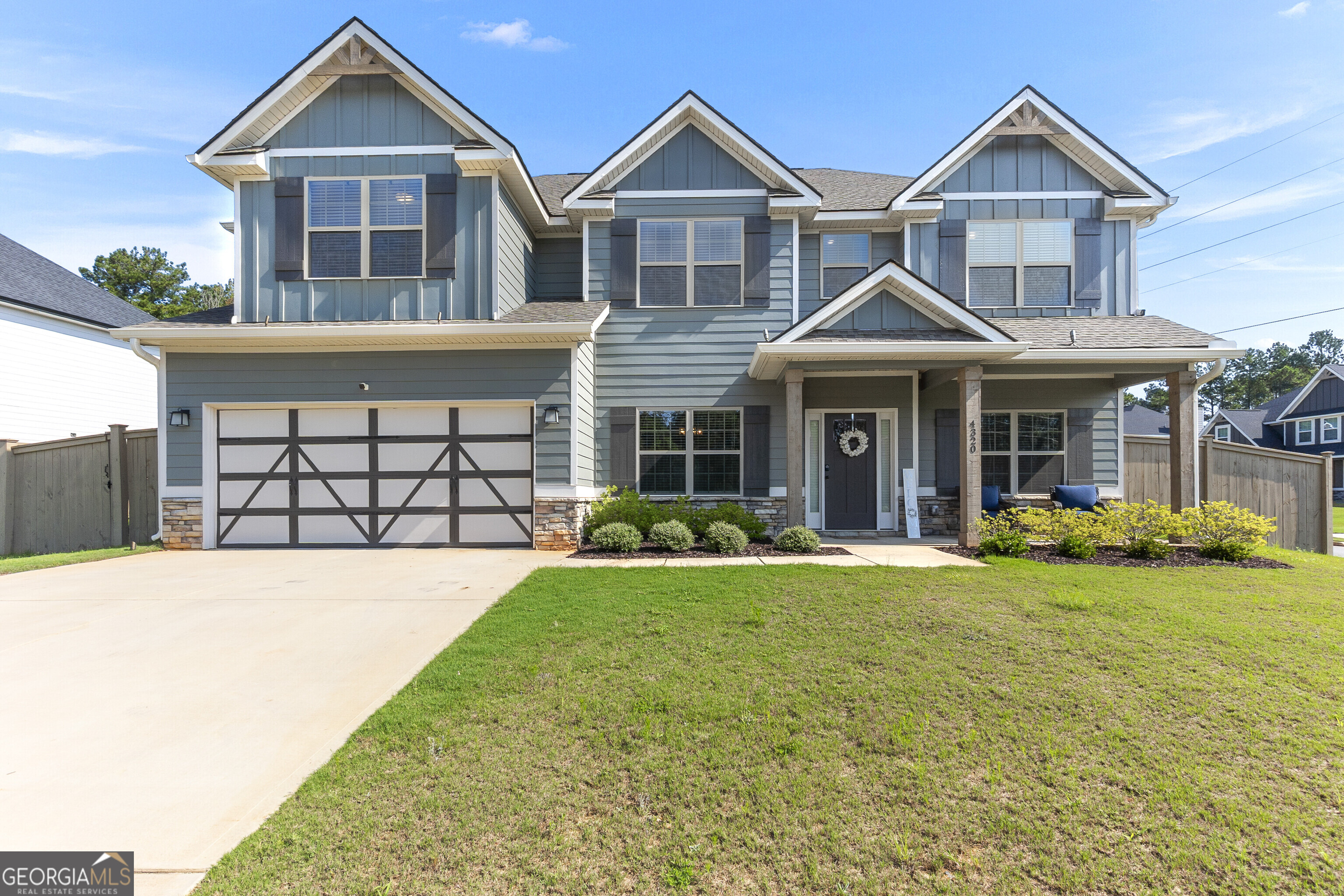 This beautiful 5BR/3BA Cypress Floor Plan offers 3,145 sq. ft. of living space and is less than 2 years old, making it practically brand new. Located in the desirable Juliette Crossing Community within the Mary Persons High School District, this home is perfectly positioned just minutes from Downtown Forsyth, shopping, dining, schools, and with easy access to I-75. Inside, you'll find an inviting open-concept floor plan featuring granite countertops, engineered hardwood floors, and elegant coffered ceilings in both the dining room and great room. The hardwood stairs with wrought iron railings add a touch of sophistication, while the spacious owner's suite boasts a tiled shower and an oversized soaking tub for ultimate relaxation. Outdoor living is just as impressive with a screened GameDay porch complete with a fireplace and built-in speakers, overlooking a large fenced backyard that's perfect for entertaining or even adding a pool. A spacious driveway and two-car garage provide ample parking. With so many features and upgrades, this stunning home is a must-see - schedule your showing today because it won't last long!