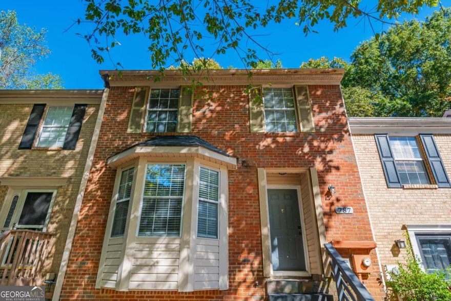 Welcome Home - terrific opportunity for first time home buyer, roommates, or landlord. This Town Home is conveniently located to 75, Express Lanes, KSU, Shopping and more! Master on Main with 2 additional Bedrooms and a shared Bathroom upstairs and Hardwoods throughout, up and down.  Kitchen has Granite Counters, Gas Range and Breakfast Island and open to Family Room and Dining Area. Open Family Room and Dining Area has Wood Burning Fireplace, Vaulted Ceilings and access to a generous sized Back Deck. Enjoy the Private Backyard views from the deck. So much potential in the huge Unfinished Basement - perfect for storage, workout room or finish off for additional living space. Access backyard with raised bed through the basement. Fee Simple, No HOA Dues, your own yard, 2 designated parking spaces.