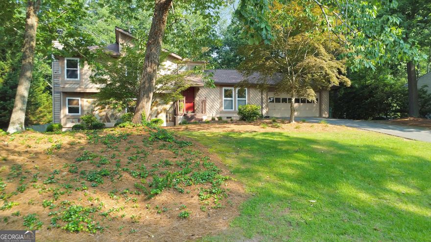 Look no further because this is the one! Welcome to this charming and well-maintained 4 bed / 3 bath split-level home in a prime East Cobb location, just minutes from the interstate and situated in the sought-after Wheeler High School district. Step inside to a bright and inviting living room featuring vaulted ceilings and a skylight that fills the space with natural light. Just a few steps down, the fireside family room offers the perfect setting for relaxing or entertaining with friends and family. The elegant kitchen is equipped with stainless steel appliances, white cabinetry, granite countertops, and a cozy breakfast area - ideal for casual meals and morning coffee. Upstairs, the primary suite offers his and hers closets and a private en suite bath. Two additional bedrooms share a hall bath on the upper level, while the lower level includes a fourth bedroom, full bath, and laundry room. The expansive back deck overlooks a private backyard with a large flagstone patio, offering plenty of space for relaxing or entertaining. Don't miss this fantastic opportunity to own a beautiful home in one of East Cobb's most convenient locations!