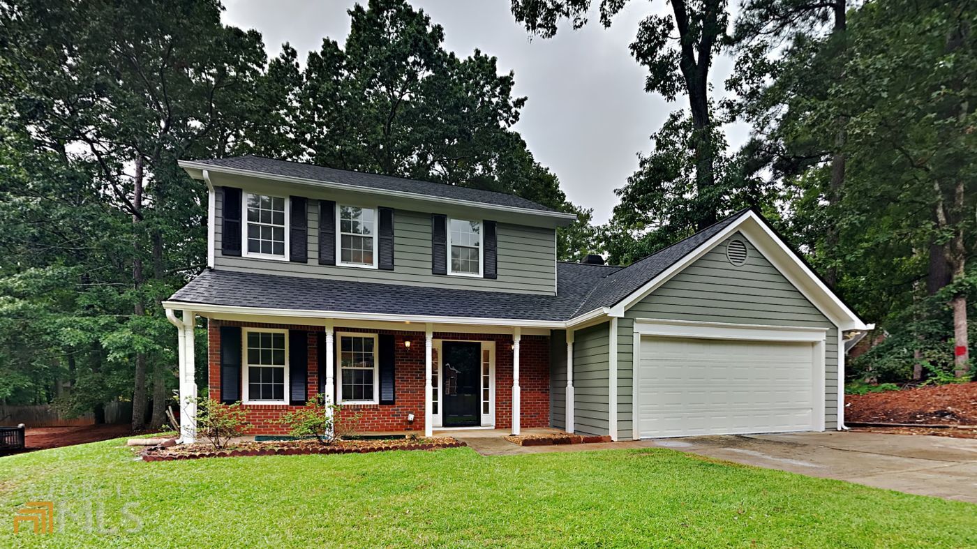 Great looking renovated Hidden Hills Stone Mt 3 bedroom 2.5 bathroom 2 story on a slab foundation with a 2 car garage. It features a new roof , new exterior and interior paint, new flooring throughout , new light fixtures, new granite countertops and stainless steel dishwasher and range. Enjoy your formal living and dining room, and a breakfast nook that overlooks the spacious family room that has a cozy fire place. The primary suite has an en-suite with dual sinks , soaking tub and separate shower. The two bedrooms are large and offer ample natural light. The backyard is level and has a storage shed. This is a great home to buy. The location is convenient to downtown Stone Mountain