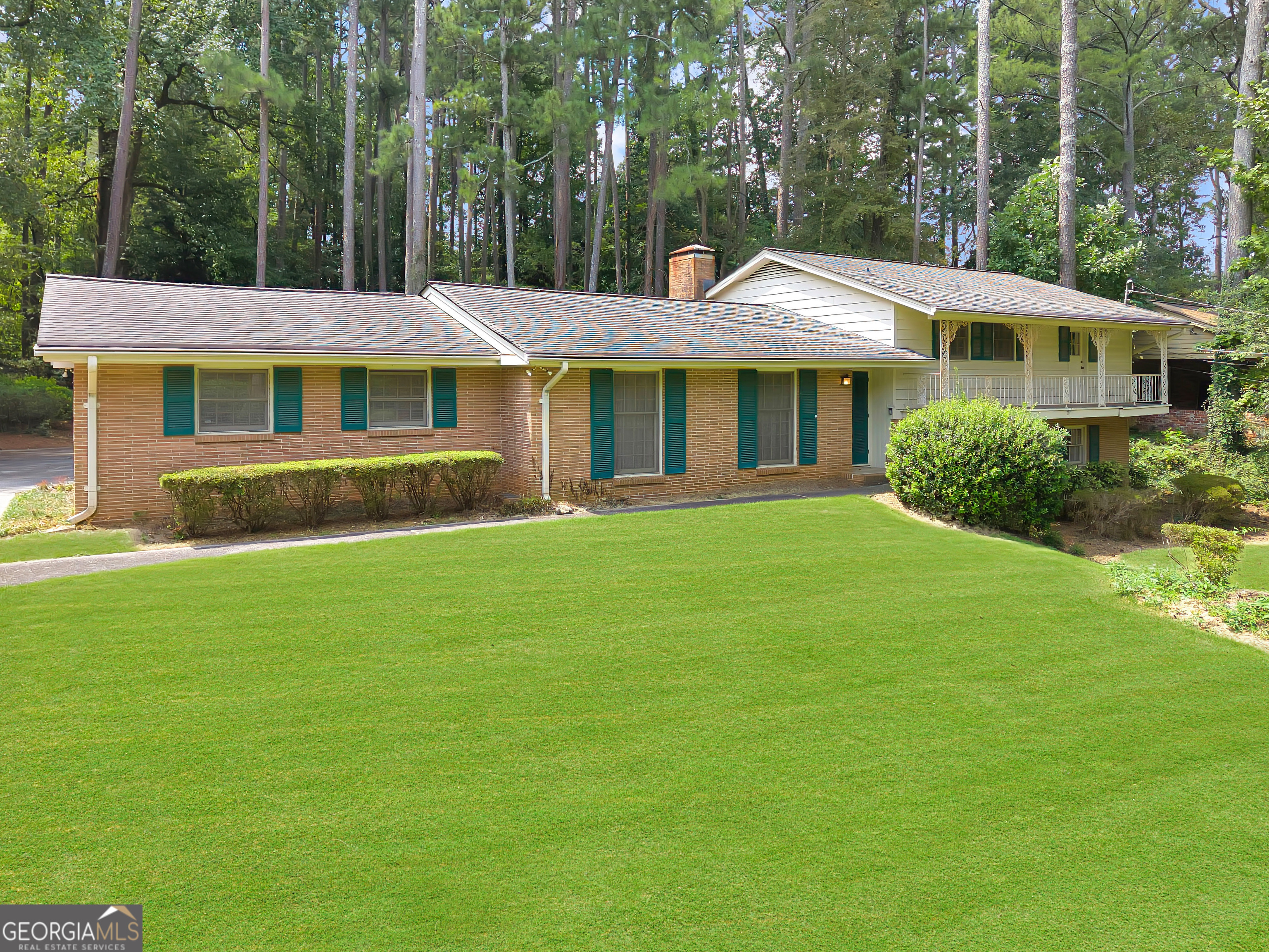 Charming 1961 split-level ranch with endless potential in a park-like setting. Offered for the first time by the family, this well-maintained 4-bedroom, 3-bath split-level ranch is ready for its next chapter. Built in 1961 and lovingly cared for ever since, this home has been the backdrop of many treasured memories-and now it offers the perfect opportunity for a new owner to create their own dream home. Sitting gracefully on a gentle hill, the home is surrounded by lush, mature landscaping that feels like your own private botanical garden. Native azaleas, hydrangeas, and a variety of established shrubs frame a sprawling lawn, creating a tranquil retreat where you can enjoy coffee or wine on the back patio while soaking in the view. The manicured front yard is equally inviting, with a balcony overlooking the greenery and a neighborhood known for its warm, welcoming community. Hawthorne Elementary is just around the corner, and neighbors of all ages contribute to the friendly, vibrant feel. Inside, you'll find original hardwood floors and an abundance of space across multiple levels. The lower level is a true highlight, offering incredible flexibility with a 4th bedroom, a 3rd full bathroom, and a large bonus room with its own separate entry and patio. This versatile space can easily be reimagined as a 5th bedroom, recreation room, teen suite, in-law suite, short-term rental, or even a home office. The possibilities for extra living space or income potential are endless. A partial basement provides even more space with room for a workshop and ample storage. Life here also comes with enviable community amenities and convenience. The neighborhood offers optional membership to the Briarmoor Manor Pool, currently being renovated, with one of the area's top swim teams. You're also close to Globe Academy, Mary Scott Nature Park, and all the perks of inside-the-perimeter living. Shopping, dining, and entertainment in Decatur, Downtown Atlanta, and Buckhead are minutes away, with quick access to interstates 85 and 285. The new Arthur Blank Children's Hospital, CDC, and Emory are all nearby as well, making this location as practical as it is desirable. Whether you're looking to restore its mid-century character or design a modern dream home, this property offers a rare opportunity: a spacious house, a beautiful lot, and a neighborhood that buyers dream about. Bring your vision and see what's possible! Estate owned, sold AS IS with right to inspect.
