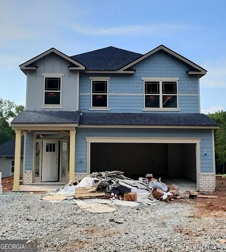 Last Corner Lot Master On Main! Charming 5-Bedroom 3.5 bath home in the most sought out subdivision in Cornelia, Ga! Nestled in the middle of this peaceful neighborhood, this 2,709 sq. ft. residence perfectly blends style, comfort, and modern conveniences. Welcome to 285 Magnolia Villas Drive (Lot 86) boasting 5 spacious bedrooms and 3.5 baths and a bonus loft! This property offers everything you need for comfortable living and entertaining. Open concept kitchen/family room has white hardwood soft-close cabinetry, a large attention-grabbing kitchen island upgraded with charcoal black cabinetry and covered in sleek granite with ample recessed lighting, a deep bowl stainless steel sink with brushed nickel finishes, and a cozy breakfast room makes this space a chef's delight. The primary suite features a large shower with large walk-in closet and spacious room to truly unwind. Upstairs loft area is pre-wired for a ceiling fan, phone, and TV, the loft offers endless possibilities for use as a family room, office, or play area. Laundry room adds convenience and elegance located in the center of all bedrooms on the second floor, so no hauling laundry! Enjoy the covered lanai, with ceiling fan and prewired for TV, making it the perfect spot for relaxing or hosting a tailgate with our game day package. This home truly stands out with thoughtful upgrades and a prime location near local amenities. Don't miss your chance to live in this stunning property. Secure your purchase, and secure your peace, with our top-of-the-line warranty! 1 Yr. Builder's Warranty, 2 Yr. Systems Warranty, 10 Yr. Structural Warranty, 2 Pre-Closing Walk Throughs & a Smart Home Switch Package. *stock photos provided are just for visual purposes and does not reflect actual colors, finishes to be determined in home.