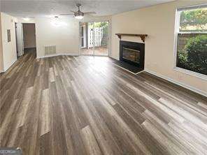 Very aggressive price to sell! Discover a hidden treasure in this charming condo, completely renovated, which has 2 BDR/2 BTH , a balcony, a fireplace, and is an excellent location close to I-285 and I-85. Convenient to shopping, park, and restaurants. Spacious, renovated with modern updates. This home offers ultimate privacy and tranquility with its peaceful, scenic view. The updated kitchen is a culinary delight, showcasing sleek white cabinets, solid stone countertops, and new appliances. Water and Trash are included with the HOA. Enjoy the amenities, including a SWIMMING POOL and TENNIS COURTS, while surrounded by beautifully landscaped exteriors that reflect the pride of this friendly neighborhood. Great for first-time buyers or retirement.