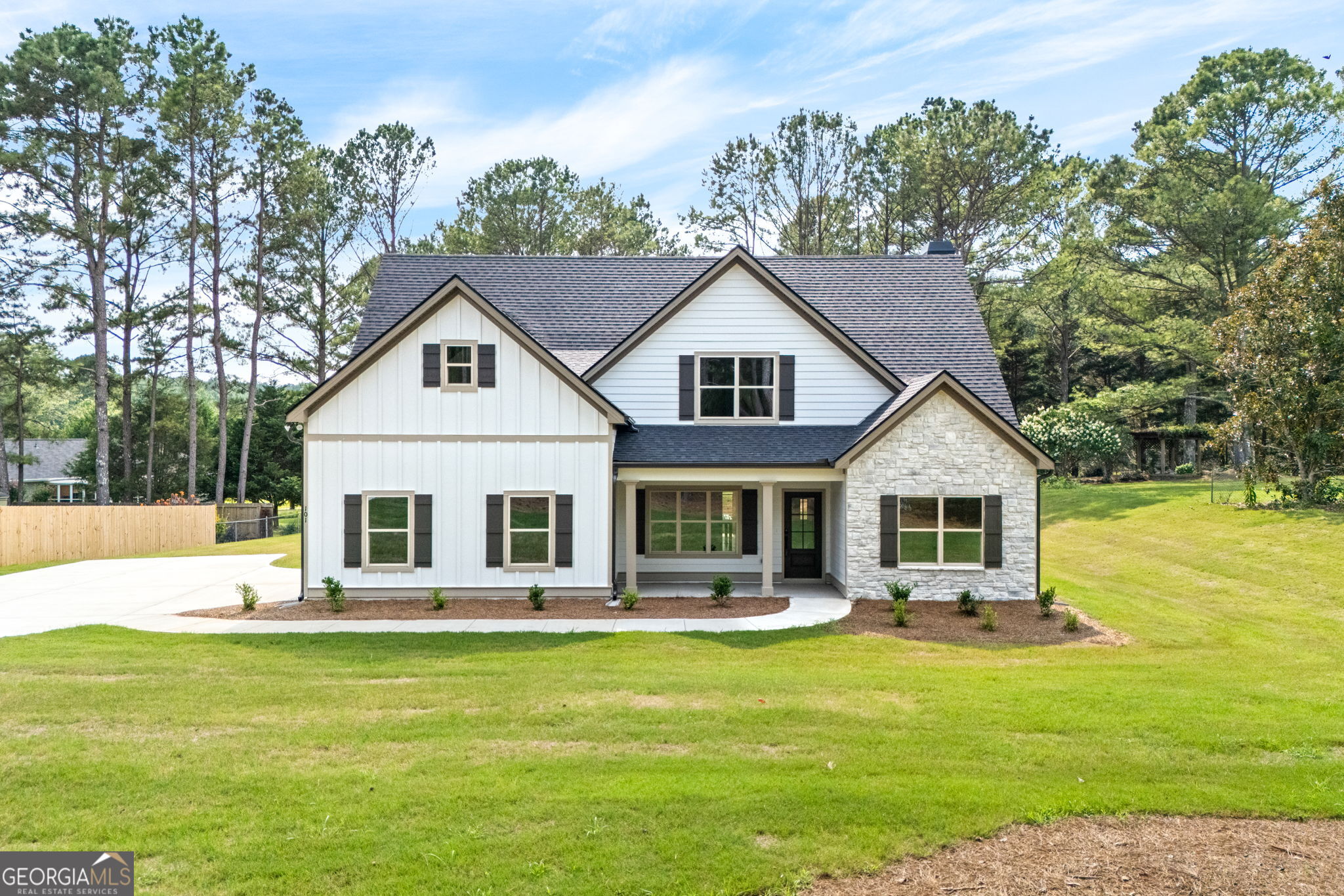 **OPEN HOUSE SUNDAY, Aug 17th 2:00 - 4:00** SOUGHT AFTER LONG CANE SCHOOL ZONE IN POPULAR PLANTERS RIDGE SUBDIVISION! TWO BEDROOMS ON THE MAIN! The Jamestown Plan features foyer opening to Dining Room. The Dining Room features trim work accent for added detail. The Family Room offers Vaulted Ceiling and wood burning Fireplace with Brick or Stone Hearth. This plan offers an open flow from Family Room/Kitchen/Breakfast Area. The Kitchen boasts shaker style cabinets, quartz or granite counters, tile backsplash, stainless appliances, and pantry. The island is a great place for serving or entertaining! On the main level, you'll find a nicely sized Owner's Suite with vaulted ceiling and can lighting. The Owner's Bathroom features tiled shower, garden tub with tile surround, double vanity, and a walk-in closet. Additionally, on the main level you'll find a guest bedroom and bathroom. On the second level you'll find a flex room ideal for playroom, media space, or office. Two guest bedrooms share a hallway bathroom featuring tiled flooring and quartz or granite counters. Each guest room is pre-wired and braced for a ceiling fan. This beautiful home features a FOAM INSULATED ATTIC, total electric construction, and architectural shingled roof. **SMART HOME TECHNOLOGY PACKAGE included for convenience** Hammett Woods is minutes from downtown LaGrange, West Point Lake, and I-85 for commuters, yet out in a peaceful country setting! Up to $5,000 toward closing costs assistance available when using builder's preferred lender!
