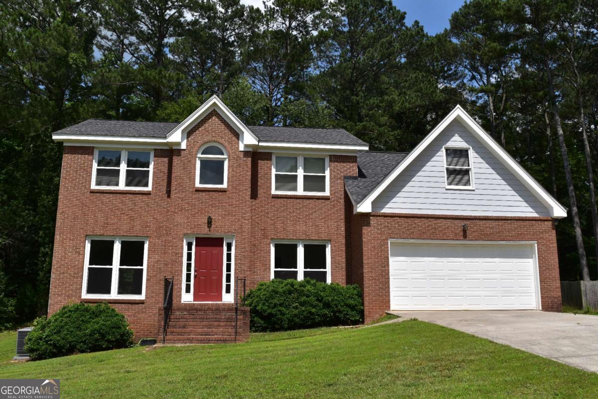 Welcome to this beautiful brick-front home with over a half-acre located just minutes from Coolray Field and the Mall of Georgia! Nestled in a well-established subdivision, this home offers timeless charm with modern touches. Inside, you'll find spacious living areas, a bright formal dining room, and a cozy family room perfect for entertaining. The kitchen features quality cabinetry, ample counter space, and a breakfast nook overlooking the private backyard. Upstairs, the oversized primary suite includes a walk-in closet and en-suite bath with a oversized garden soaking tub and separate shower. Enjoy quiet evenings on the back patio or take advantage of the proximity to shopping, dining, and entertainment. This home blends classic character with convenience and is perfect for anyone looking to live in one of Lawrenceville's most desirable areas. With no HOA and access to a voluntary pool and tennis community, you get the benefits of amenities without the restrictions. Well-maintained and recent $70,000.00+ upgrades include, Recent Hardie Siding, Sherwin-William Exterior Super Paint, Upgraded Energy e-Windows, New HVAC, New Gas water heater, Recent GAF Lifetime Architectural Shingle Roof, New Interior Paint, Carpet, Waterproof Wood Laminate flooring throughout and Concrete Driveway with upgraded 5,000 psi fiberglass fiber reinforced concrete.